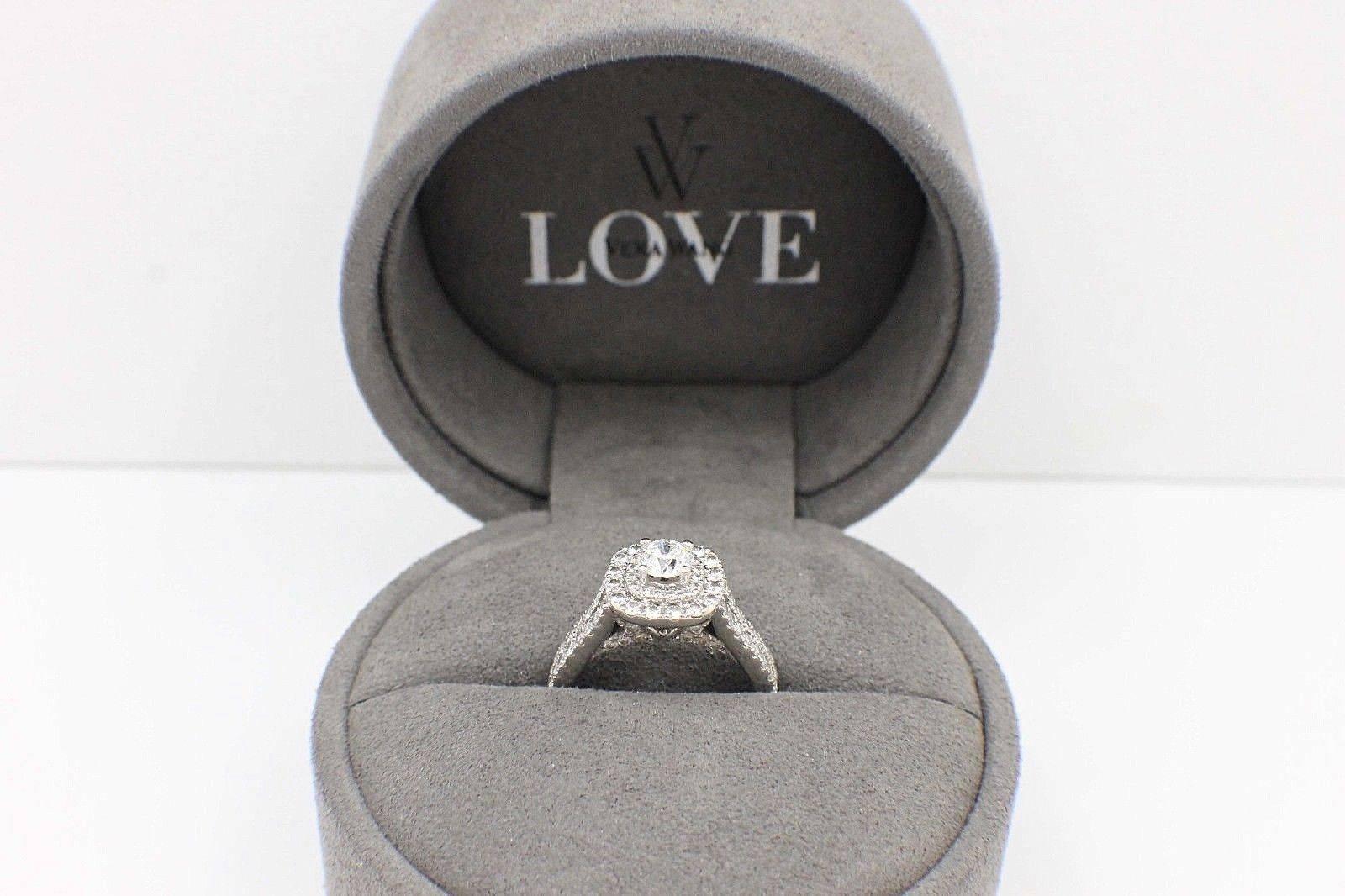 VERA WANG BRIDAL LOVE COLLECTION
Style:  Split Shank Halo Diamond Engagement Ring 1 1/2 TCW
Sku Number:  #081056208
Metal:  14KT White Gold
Size:  4.5 - sizable 
Total Carat Weight:  1 1/2 TCW
Center Diamond Shape:  Round Brilliant Diamond 0.50 CTS 