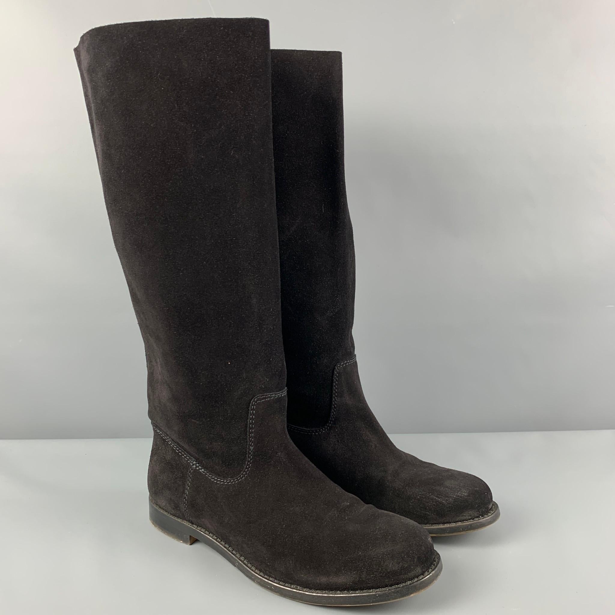 VERA WANG 'Kristen' boots comes in a black suede featuring a riding style, slip on, and a low heel. Includes box. 

Very Good Pre-Owned Condition. Light wear.
Marked: 8.5

Measurements:

Length: 10.5 in.
Width: 3.75 in.
Height: 15 in. 
