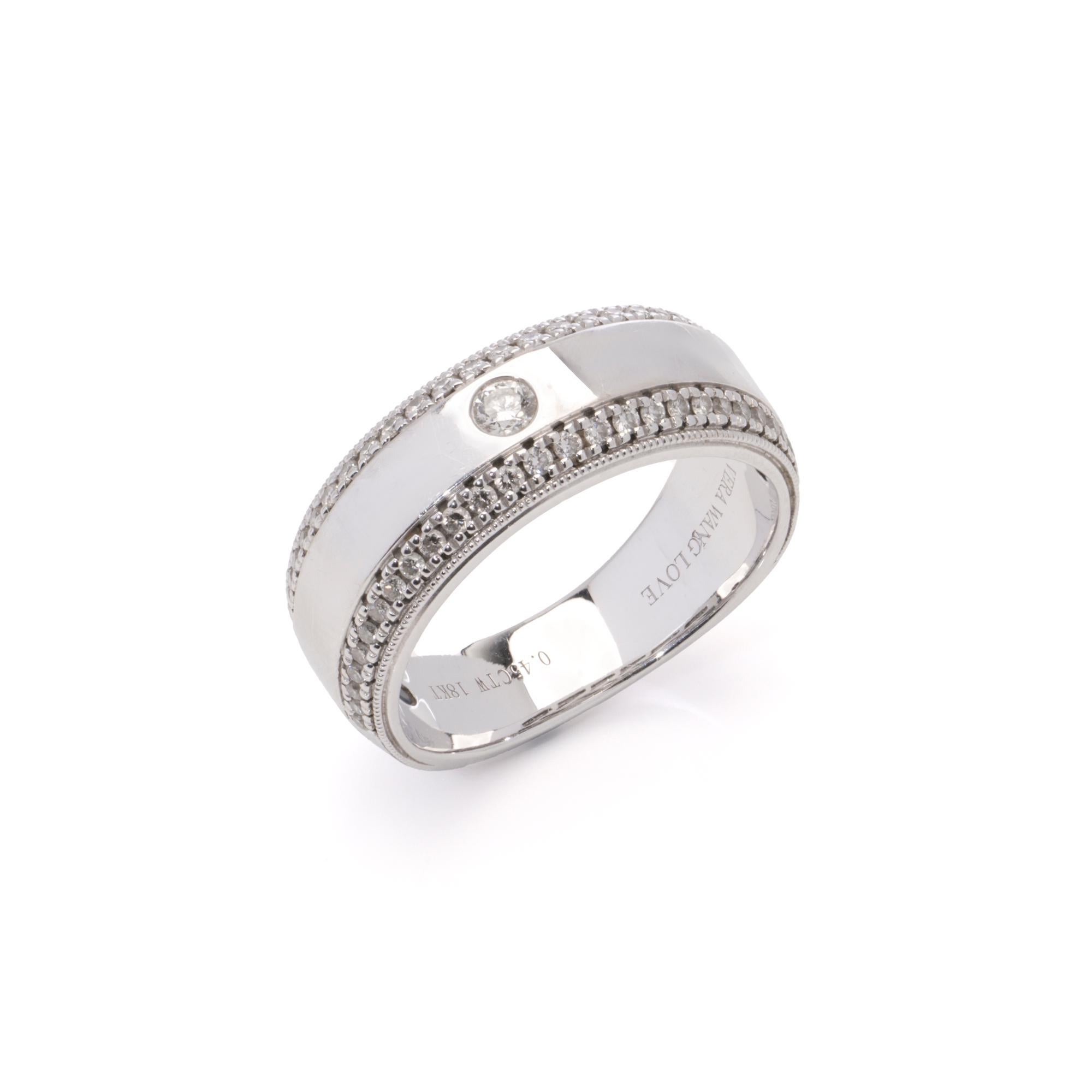 Vera Wang Love 18kt white gold diamond men's band ring.

This ring is a piece from the Vera Wang Love Collection, crafted in 18K white gold and set with a centre round brilliant-cut diamond surrounded by smaller pavé-set diamonds along the band. The