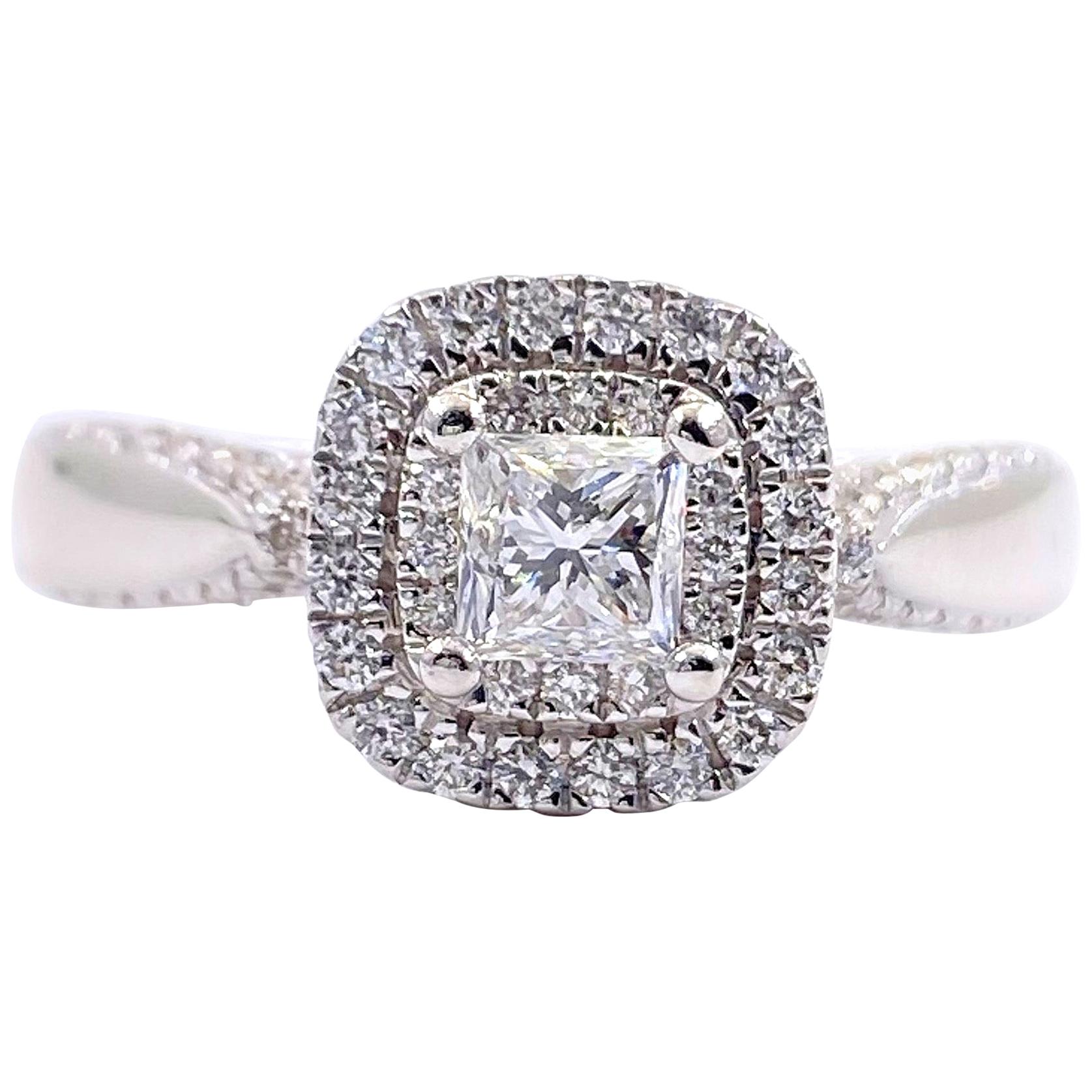 Vera Wang Love Collection Engagement Ring
Style:  Double Halo 
Ref. number: #20053709
Metal:  14kt White Gold
Size / Measurements:  5.5 - sizable
TCW:  7/8 or 0.80 tcw
Main Diamond:  Princess-Cut Diamond 0.45 cts
Color & Clarity:  I / I1
Accent