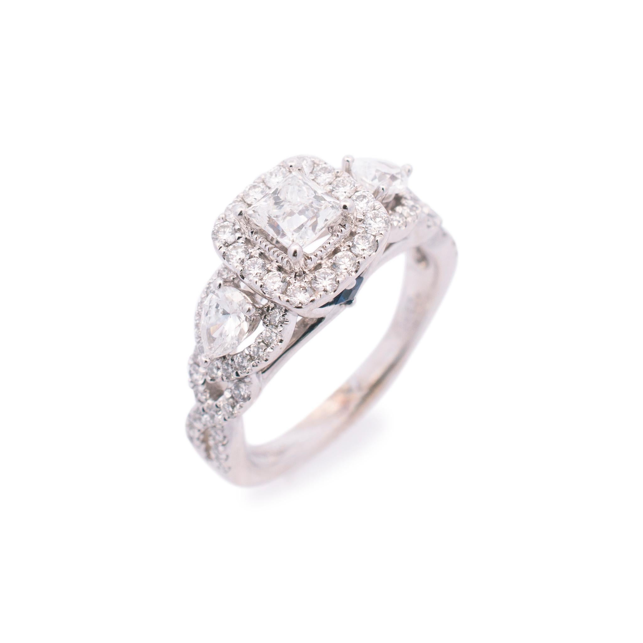 Brand: Vera Wang

Gender: Ladies

Metal Type: 14K White Gold

Size (US): 6.5

Shank Width: 2.00mm

Head Measurements: 9.00mm

Weight: 5.70 grams

Ladies VERA WANG 14K white gold diamond and sapphire engagement halo three-stone ring with a half round