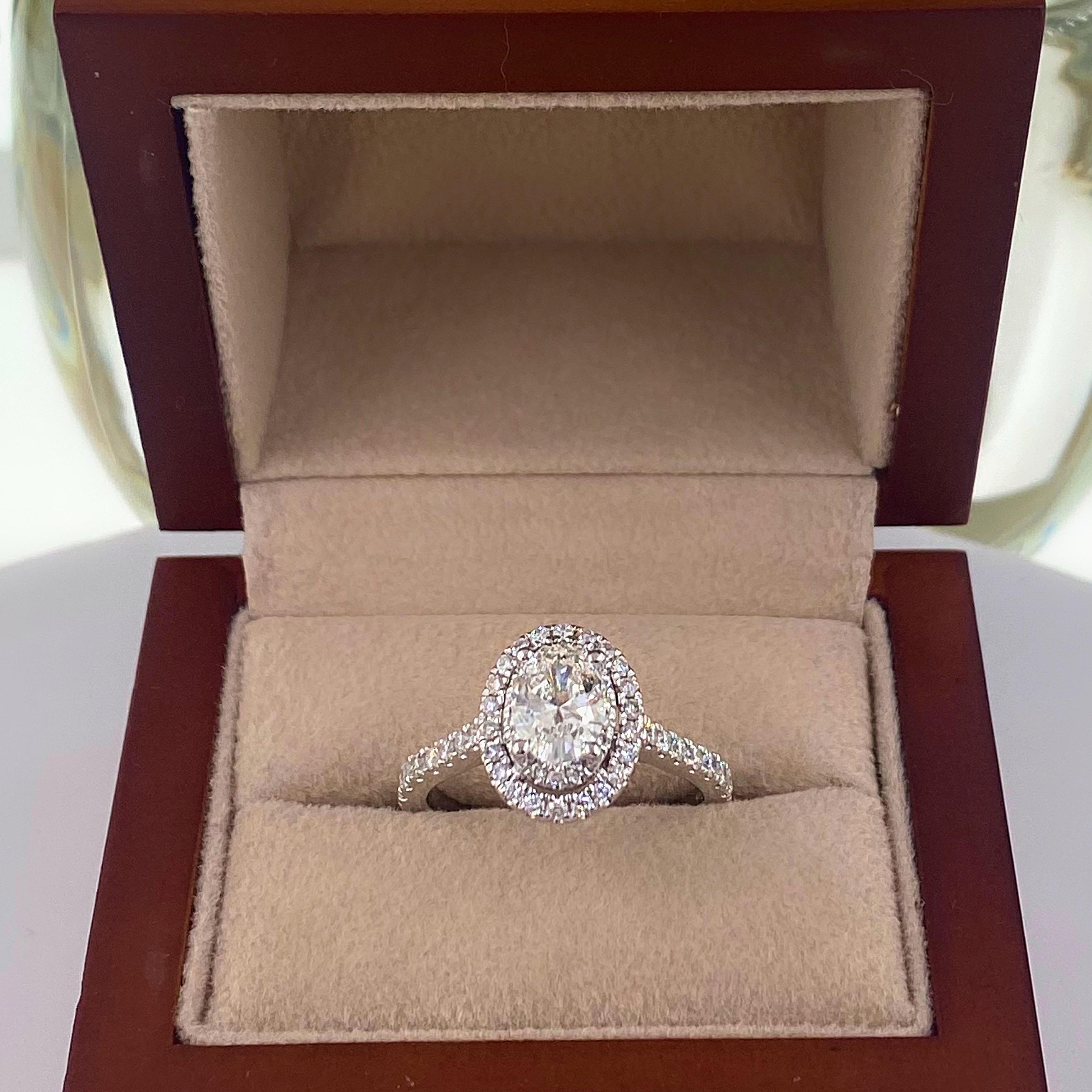 Vera Wang LOVE Collection Double Halo Engagement Ring
Style:  20138338
Metal:  14kt White Gold
Size:   - sizable
TCW:  1.64 tcw ( 1 5/8 )
Main Diamond:  Oval Shape Diamond 1.01 cts
Color & Clarity:  G, SI2
Accent Diamonds:   64 Round Brilliant Cut