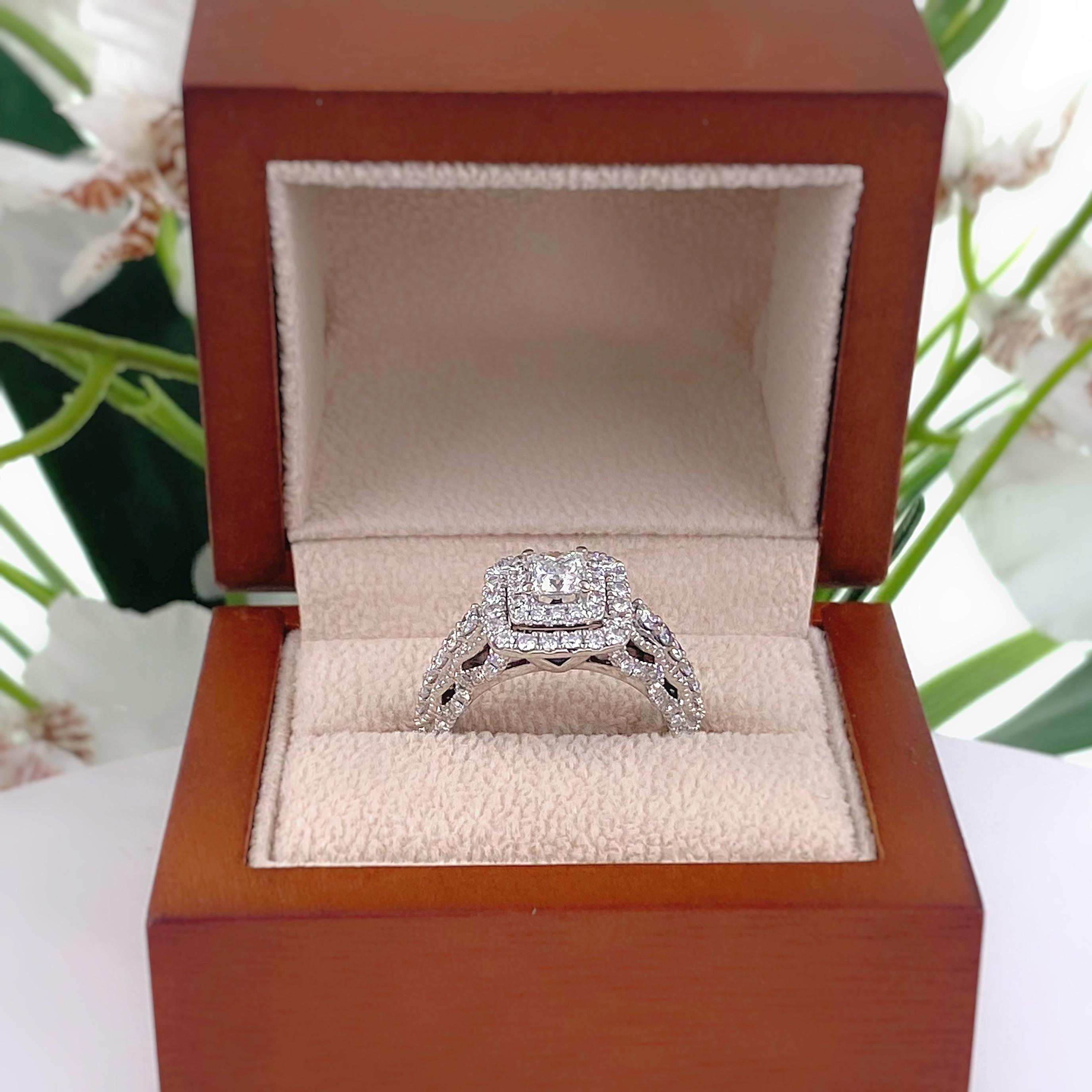 Vera Wang LOVE Princess Diamond Engagement Ring
Style:  Double Halo
Metal:  14kt White Gold
Size:  7 sizable
TCW:  1.32 tcw / 1 1/3 tcw
Main Diamond:   Princess Cut Diamond. 0.45 cts
Color & Clarity:  I, I1
Accent Diamonds:   96 Round Brilliant