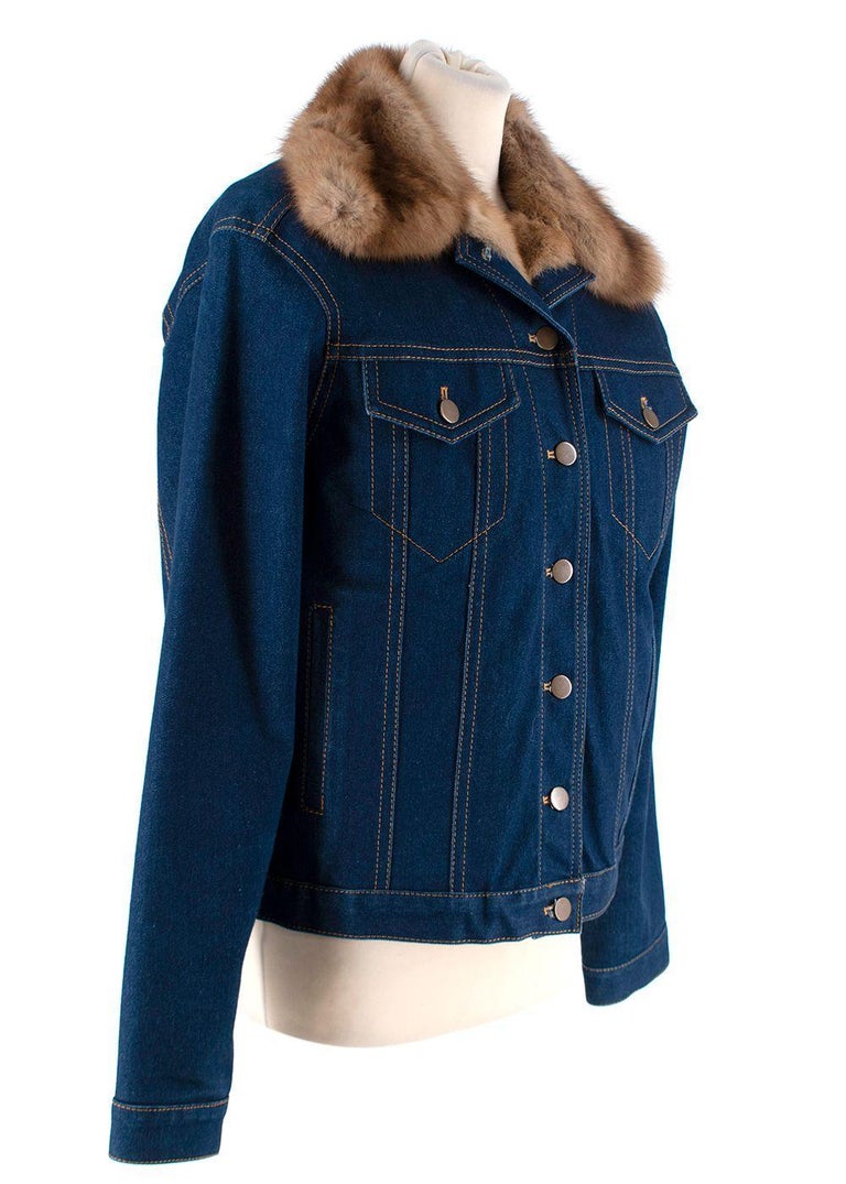 Vera Wang Indigo Denim Jacket with Sable Lining

- Classic blue denim jacket with tan stitching
- Button-up closure
- Two side pockets
- Partially lined with sable fur

Materials:
Sable
Cotton

Origin of fur: Russia

PLEASE NOTE, THESE ITEMS ARE