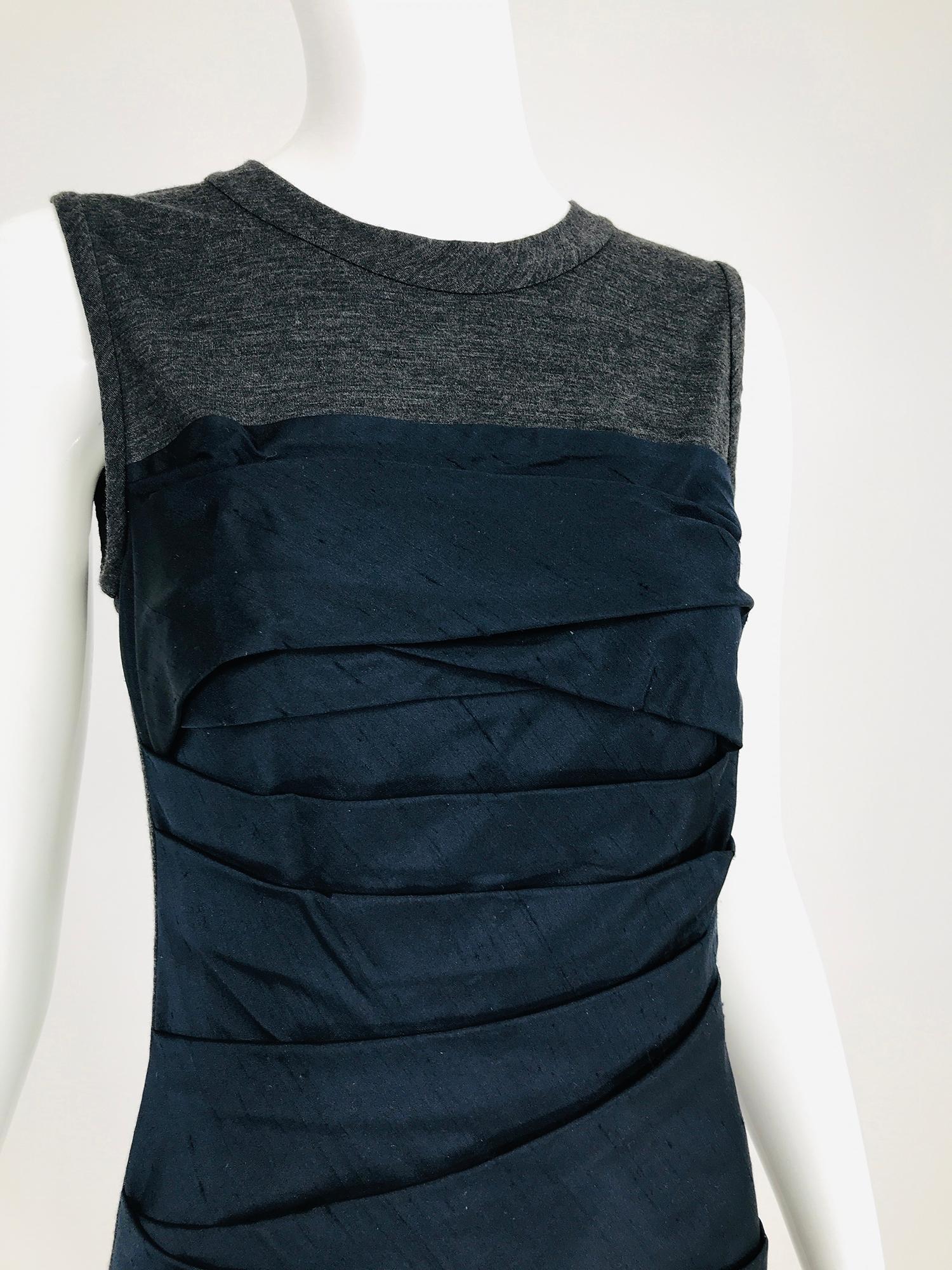 Vera Wang pleated black silk & charcoal knit jersey sleeveless sheath dress. Fitted, sleeveless dress with a jewel neckline, the upper bodice, dress back and interior front are charcoal knit jersey. The torso to the hem of the dress front is done in