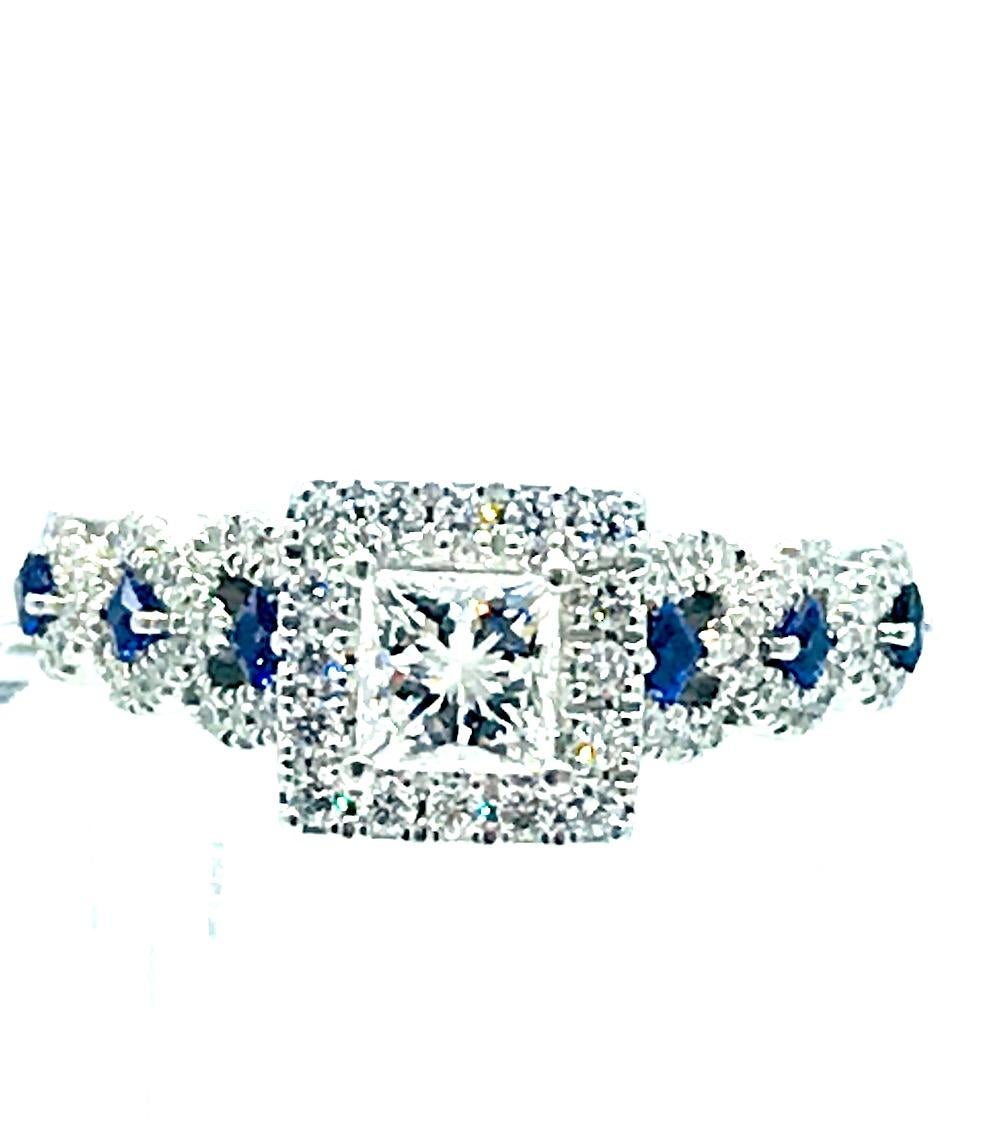 Vera Wang Love Collection 1 CT. T.W. Diamond and Blue Sapphire Engagement Ring in 14K White Gold. Original price sells for $3995.
This ring is in excellent condition so don't miss out.

Center diamond is a princess cut measuring 4.42 mm in a halo