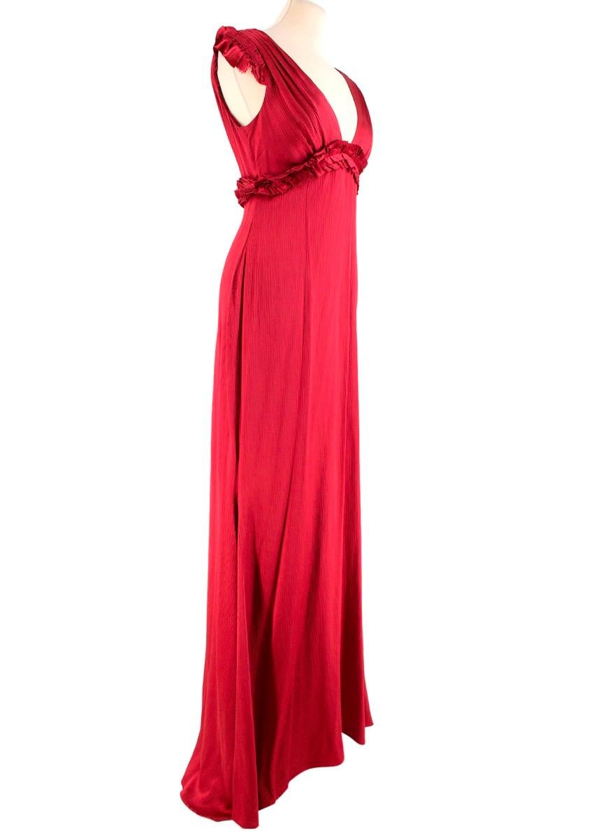 Vera Wang Burgundy Red V-neck Silk Gown

- Burgundy Red Gown
- V-neck, sleeveless
- Ruffled shoulders and waist detail
- Waist ribbon, tied in the back
- Zip fastening closure at the rear end

Please note, these items are pre-owned and may show some