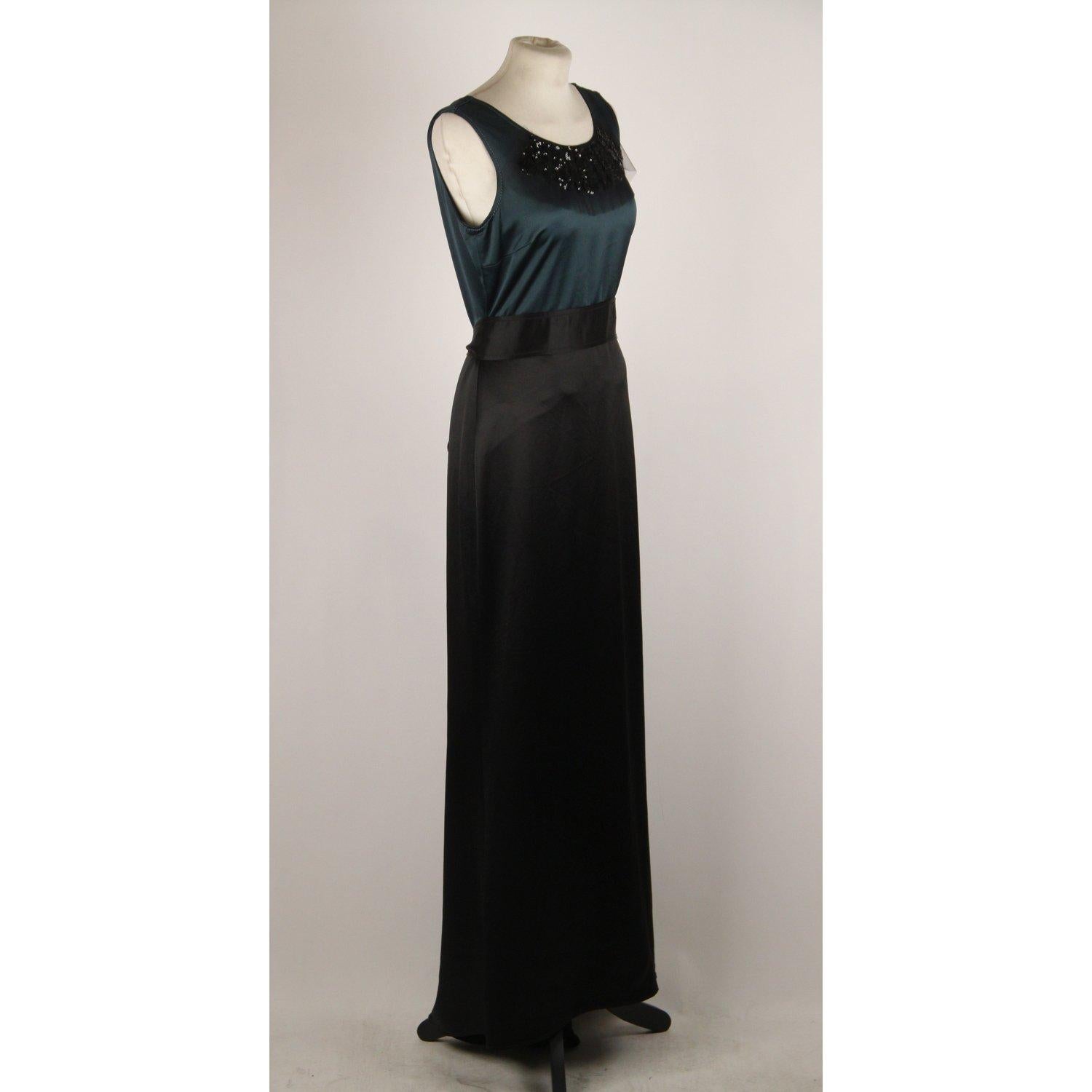 MATERIAL: Satin COLOR: Green, Black MODEL: Evening Dress GENDER: Women SIZE: Small COUNTRY OF MANUFACTURE: China Condition CONDITION DETAILS: B :GOOD CONDITION - Some light wear of use - Some wear of use on fabric on the hem due to normal use