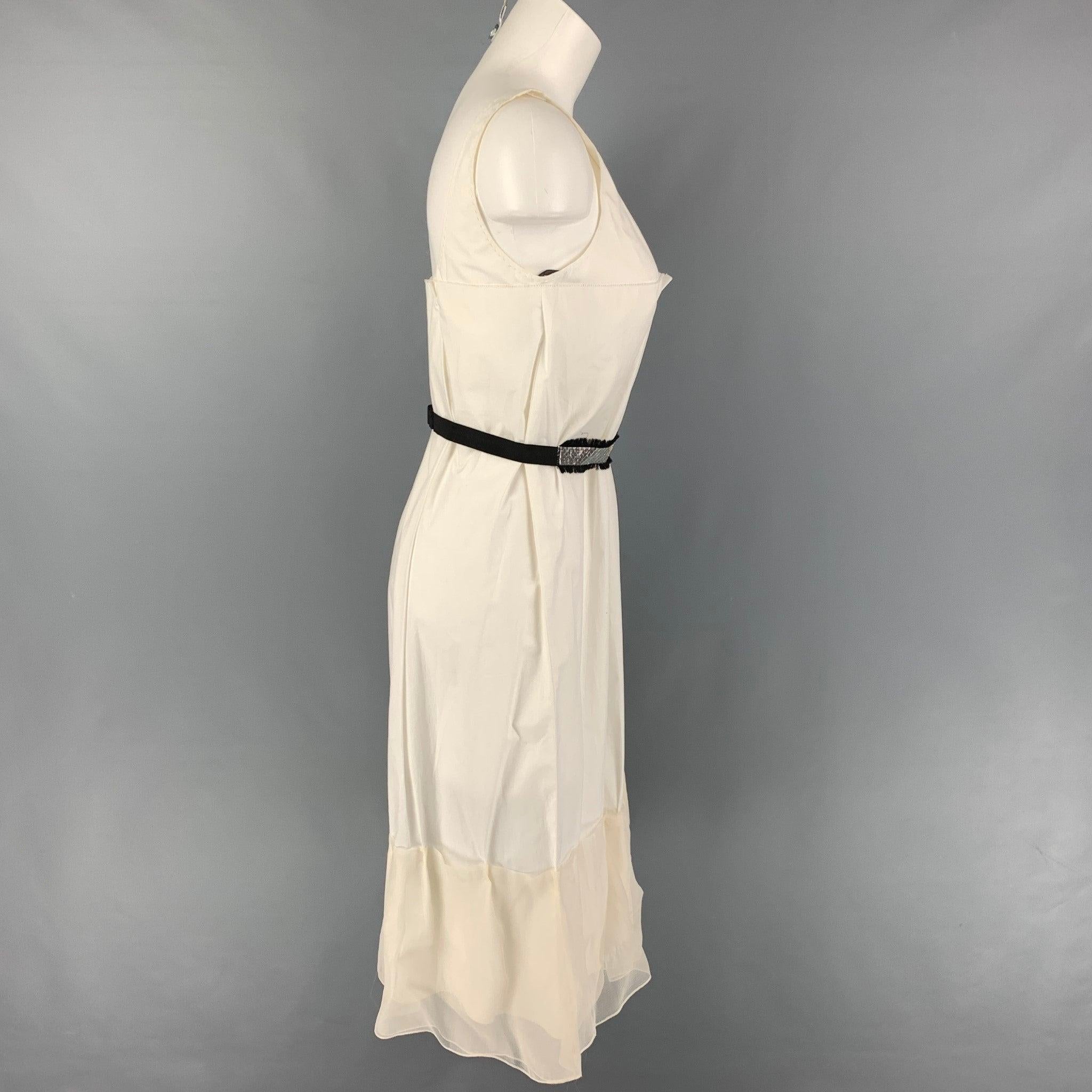 VERA WANG dress comes in a white cotton featuring pleated style, mesh ruffled trim, silver belt, and a side zipper closure.
Very Good
Pre-Owned Condition. 

Marked:   2 

Measurements: 
  Bust: 30 inches  Hip: 40 inches  Length: 34 inches 
  
  
