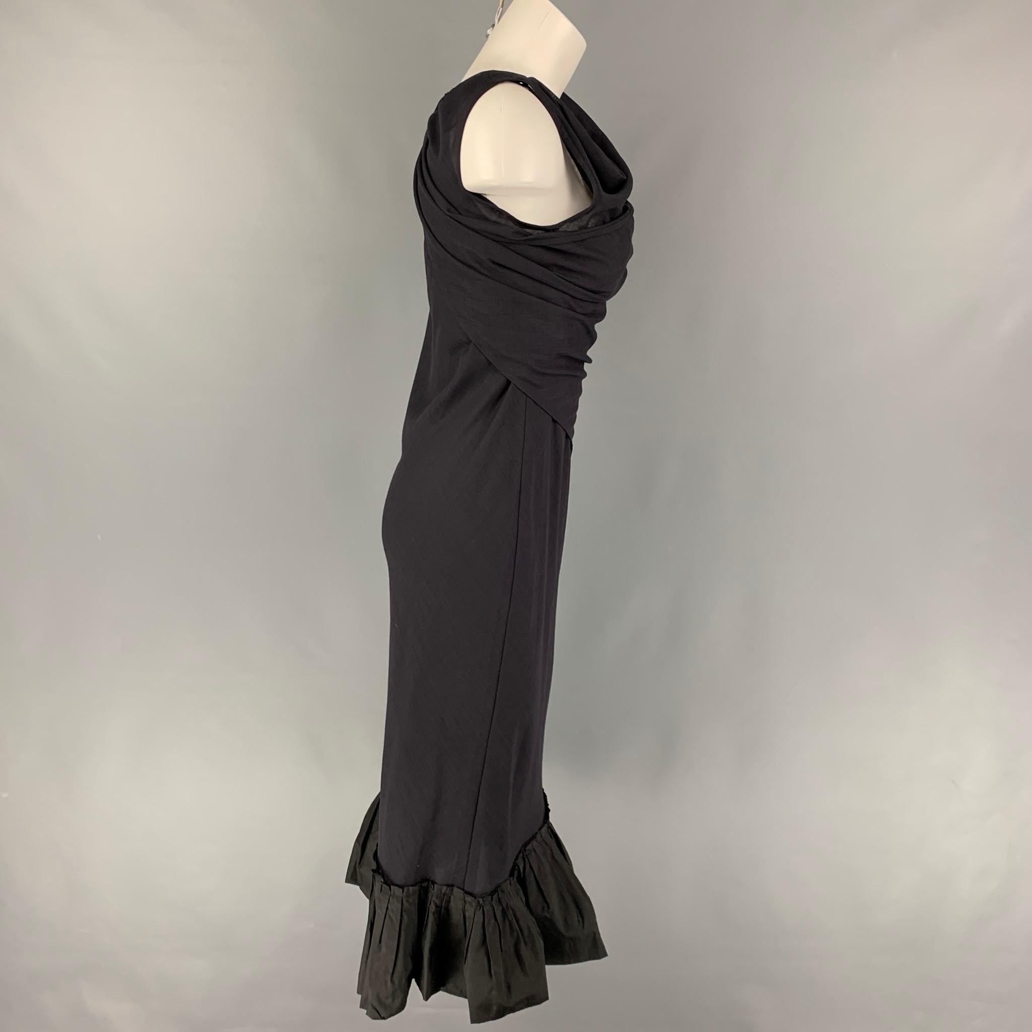 VERA WANG dress comes in a navy wool featuring a wrap around panel, ruffled trim, sleeveless, and a back zip up closure. 

Very Good Pre-Owned Condition.
Marked: 4

Measurements:

Shoulder:
Bust: 28 in.
Waist: 26 in.
Hip: 33 in.
Length: 45.5 in. 