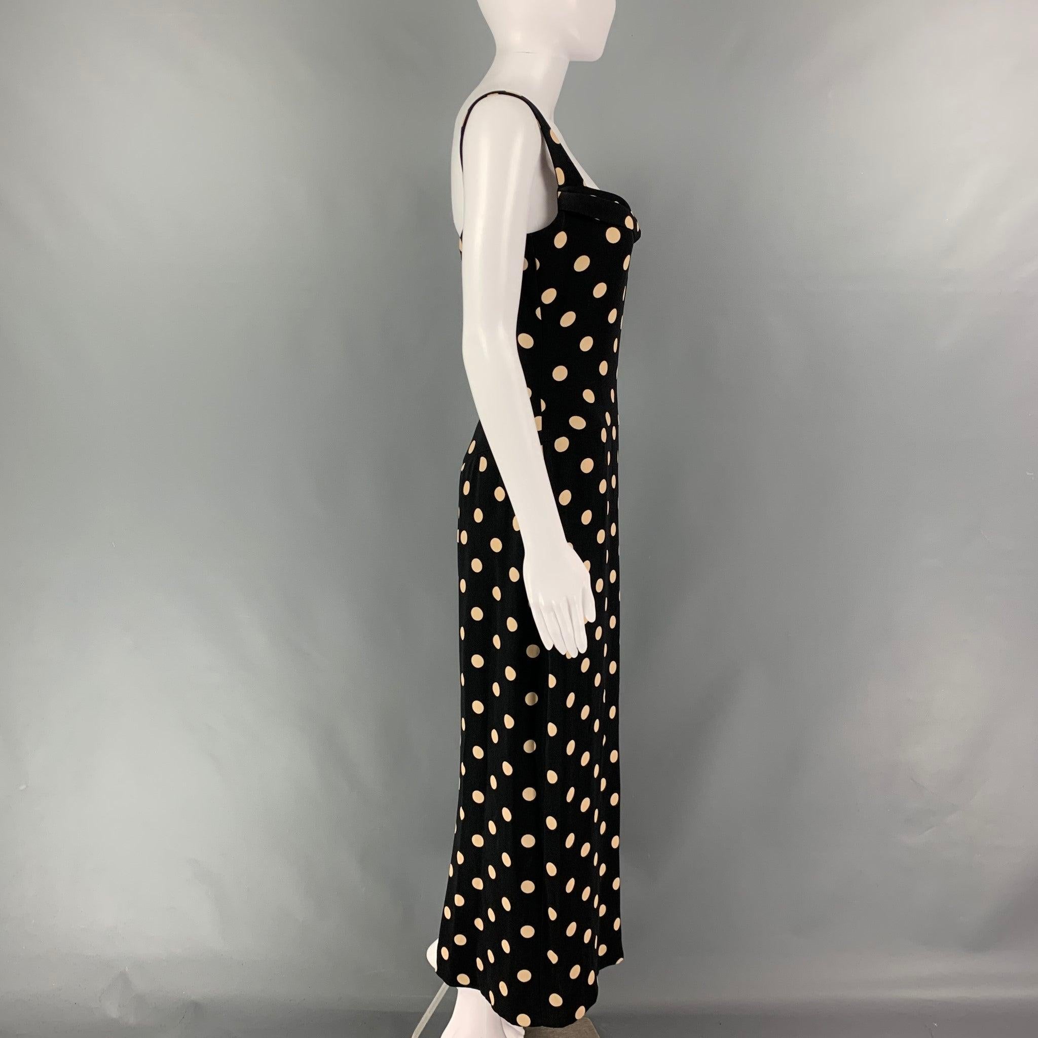 VERA WANG dress comes in a black & beige polka dot silk crepe featuring a draped neckline. Made in USA. Very Good Pre-Owned Condition.
Minor signs of wear. As- Is. 

Marked:  8 

Measurements: 
 Bust: 34 inches Waist: 29 inches Hip: 40 inches