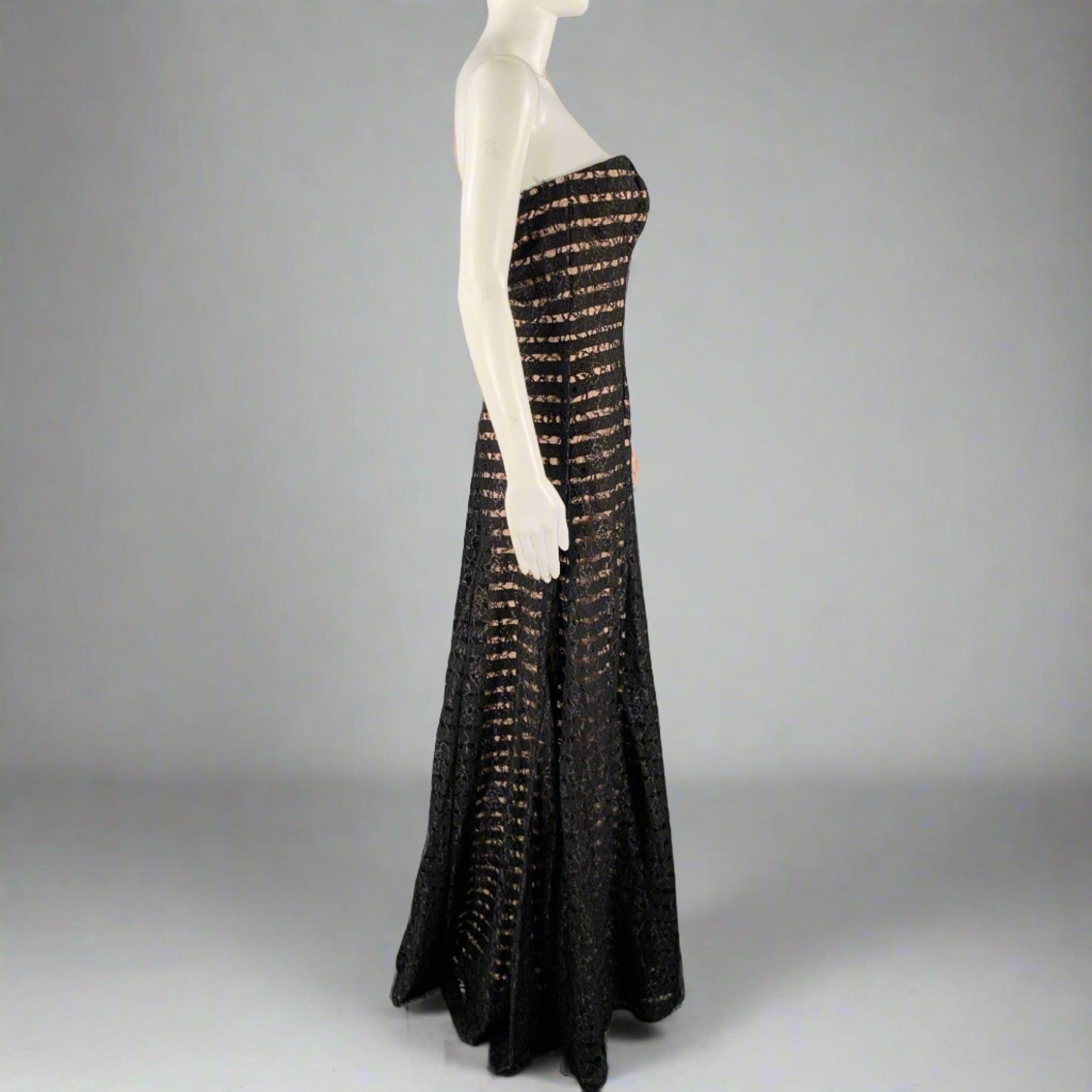 VERA WANG dress in a black and pink nylon blend fabric featuring a stripe pattern with lace overlay, strapless style, and back zipper closure. Very Good Pre-Owned Condition. Minor signs of wear in lace, missing removable straps. 

Marked:   8