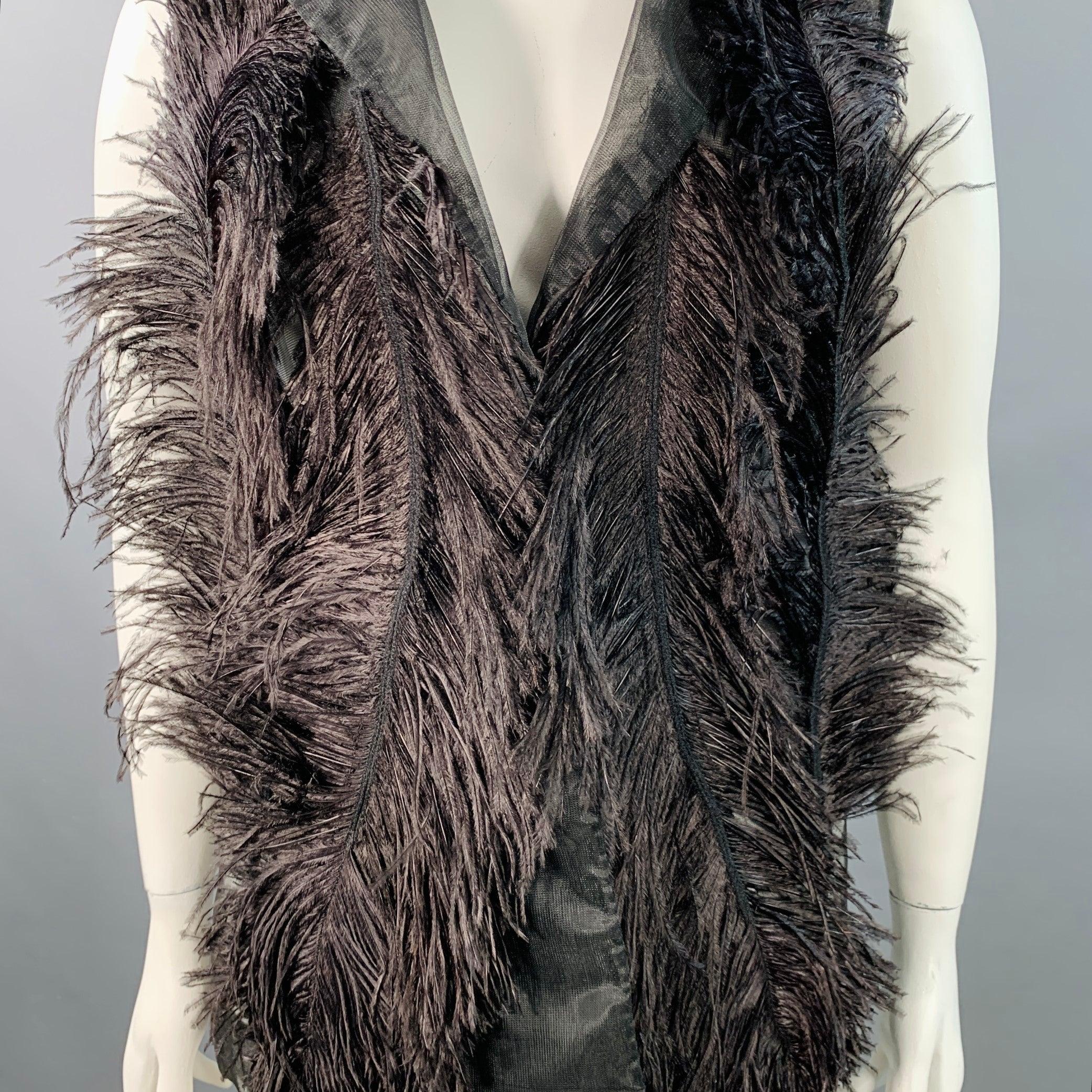 VERA WANG COLLECTION vest
in a black mesh featuring a notch lapel, front ostrich feather design, and single snap closure.Excellent Pre-Owned Condition. 

Marked:   size not marked 

Measurements: 
 
Shoulder: 15 inches Bust: 36 inches Length: 27.5