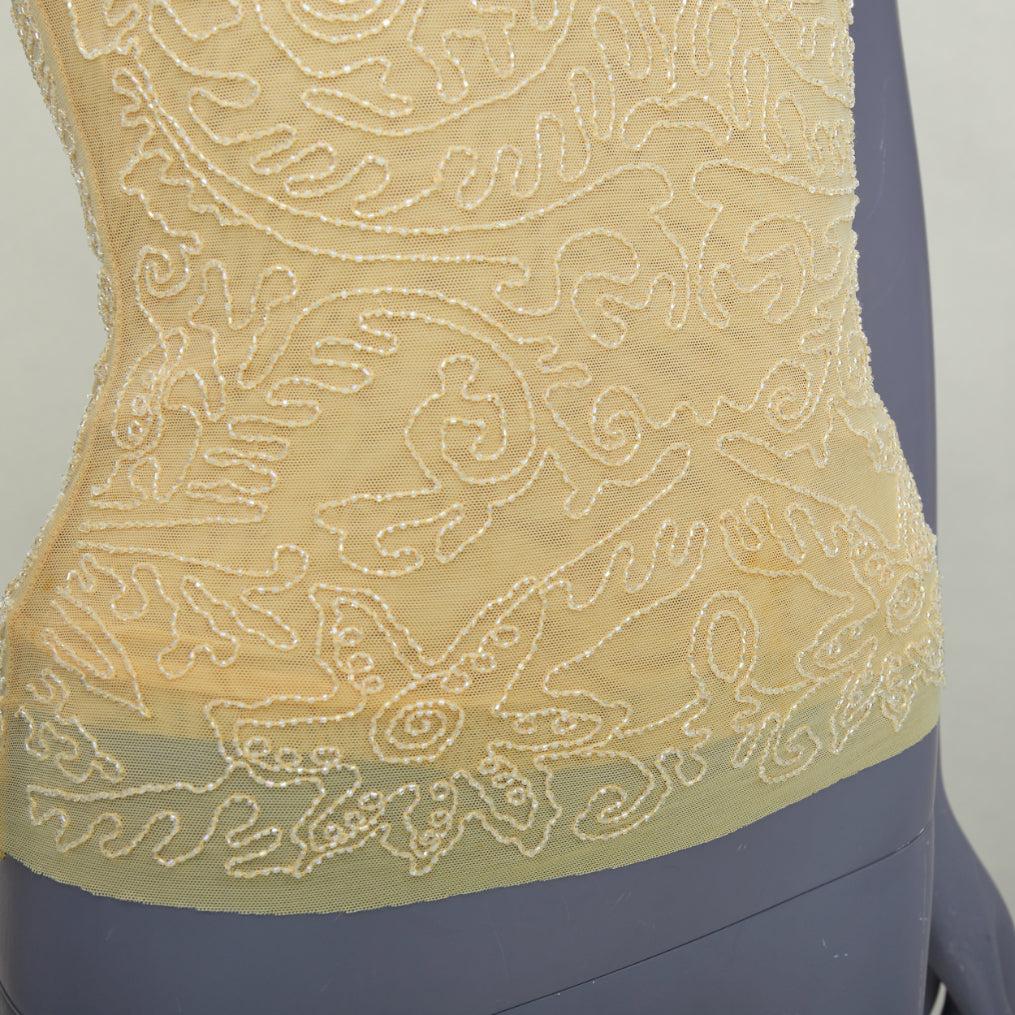 VERA WANG Vintage giallo burro impreziosito da perline e top a fascia US4 S
Riferimento: SNKO/A00590
Marchio: Vera Wang
Materiale: Sembra viscosa
Colore: Giallo, Nudo
Modello: Tinta unita
Chiusura: zip
Fodera: Rete nuda
Dettagli extra: Zip