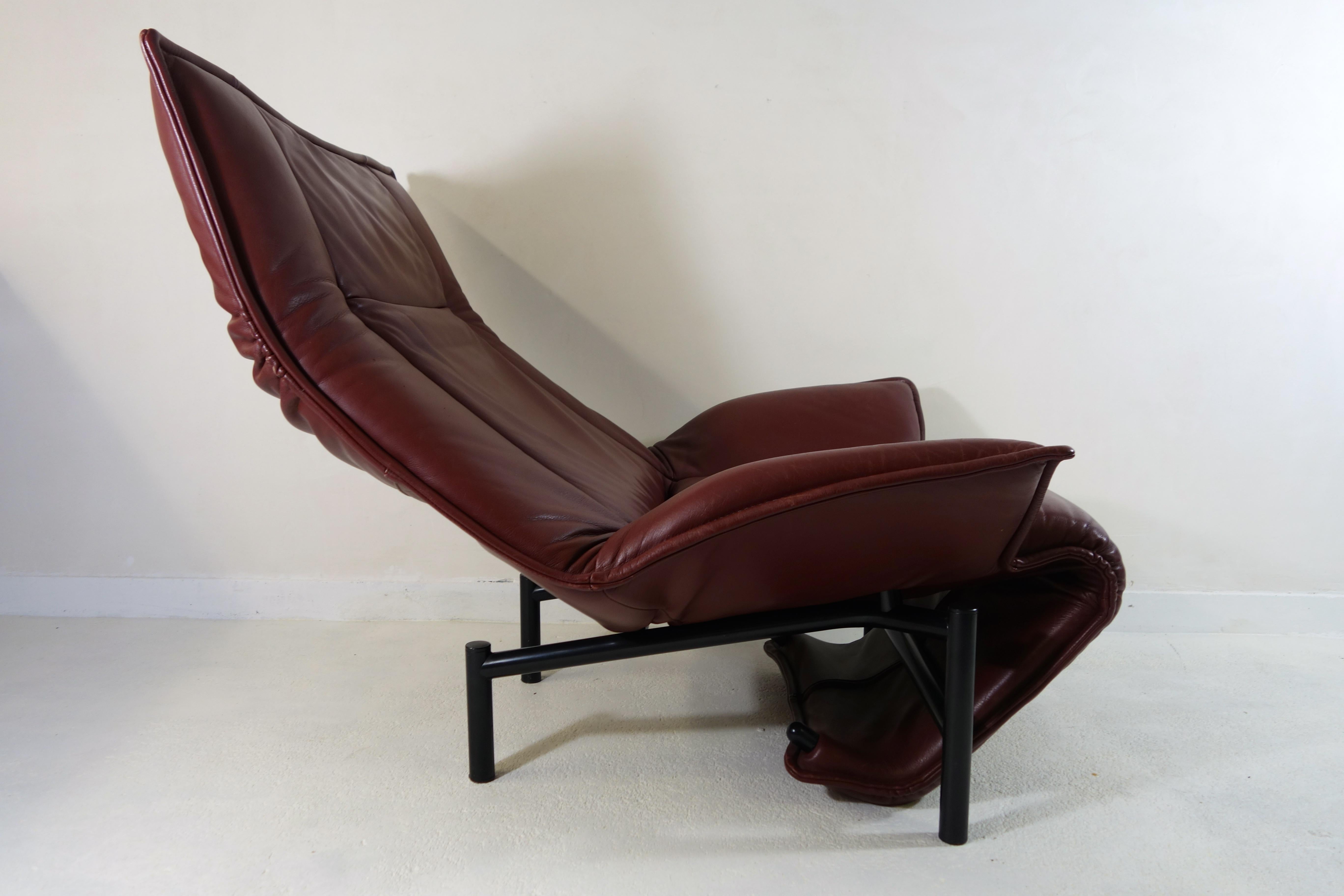 Vico Magistretti, probably best known for his Carimate Chair and Oluce Lamp, designed this extremely versatile lounge chair in 1983. 
In beautiful brown leather.
The Veranda can be positioned in multiple ways suiting your every mood. When extended