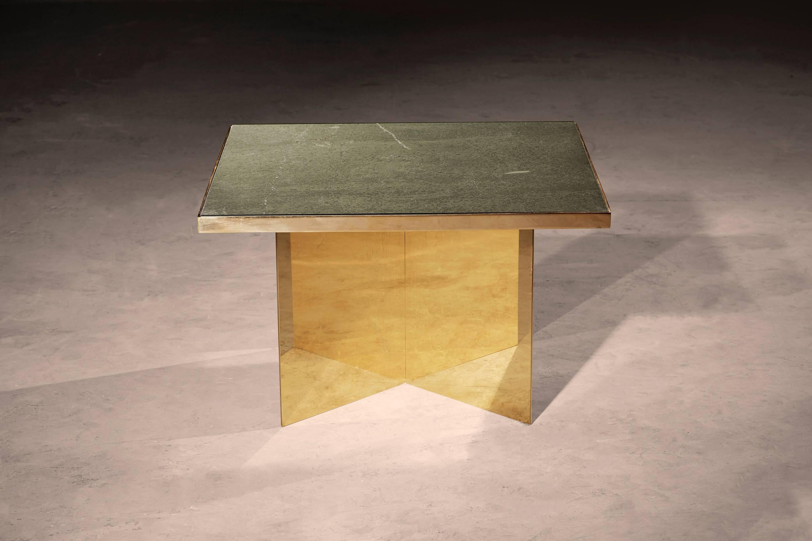 A coffee or side table in honed Cumbria slate and patinated brass. Hand crafted to order in the North. Bespoke finishes and sizes are available.

Measures: 100cm dia x 32cm height.
Custom finishes and sizes available upon request.

Made to order in