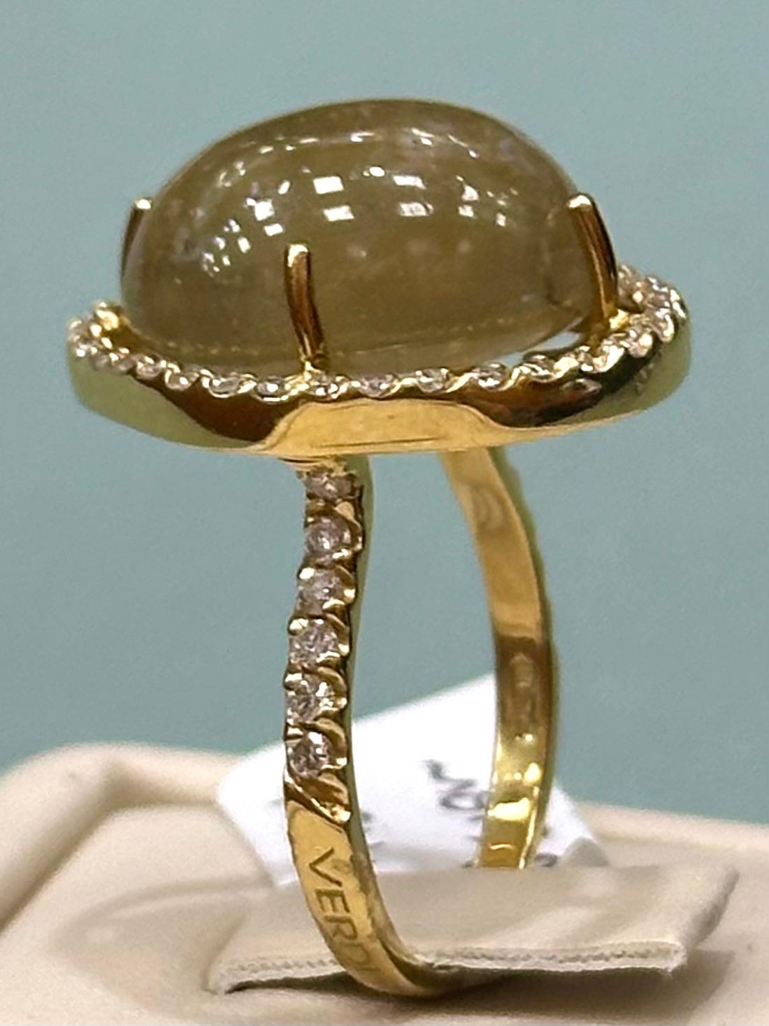 VERDI - Oval Rutile Quartz ring with a halo of diamonds of over over 1 carat.

1.15 cts of diamonds
8.61 grams 