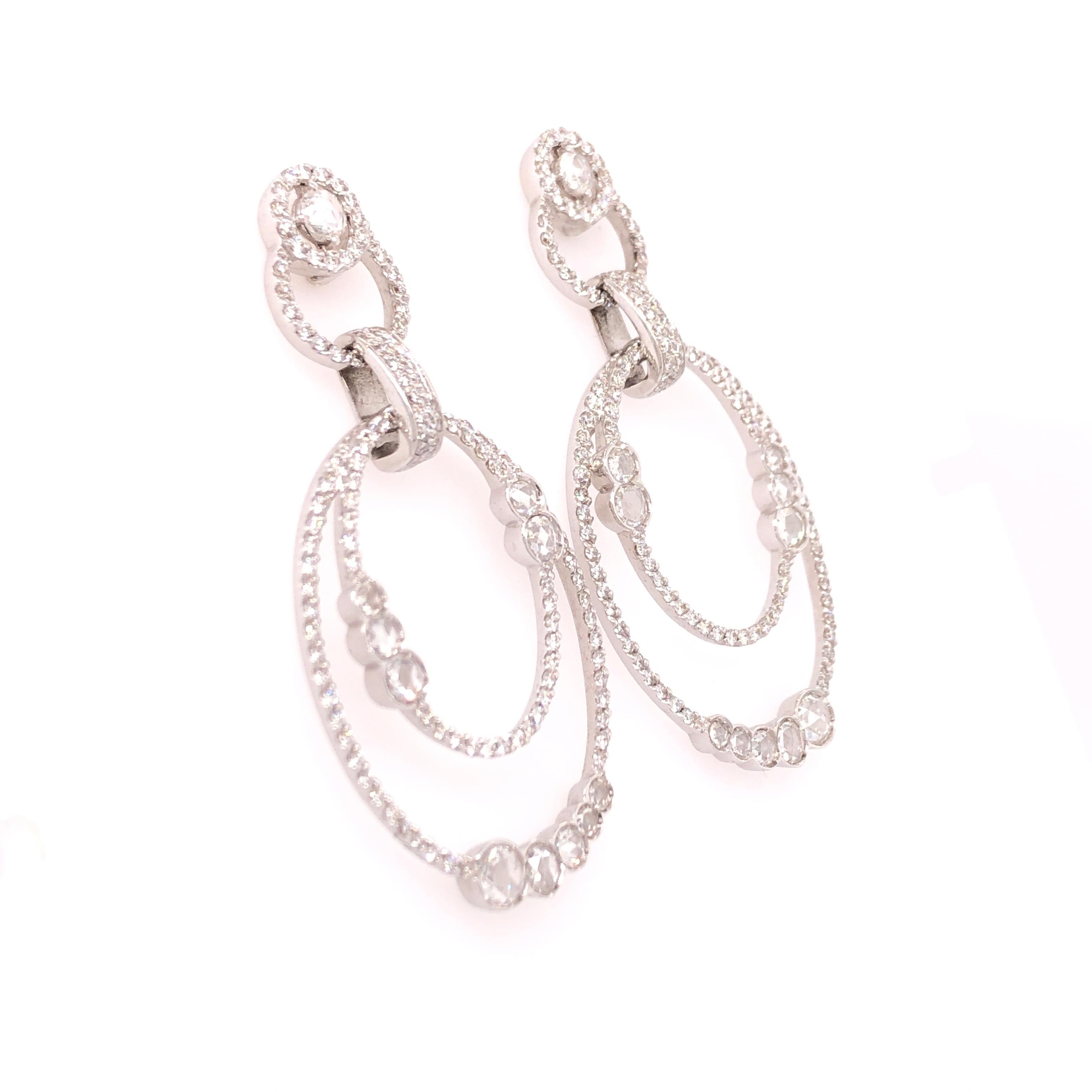 Straight from Italy, this pair of Verdi earrings is for the woman who wants to stand out without being garnish or ostentatious. The circular theme accentuates the asymmetrical symmetry of the pair. An approximate 3.29 CTW of diamonds bring the