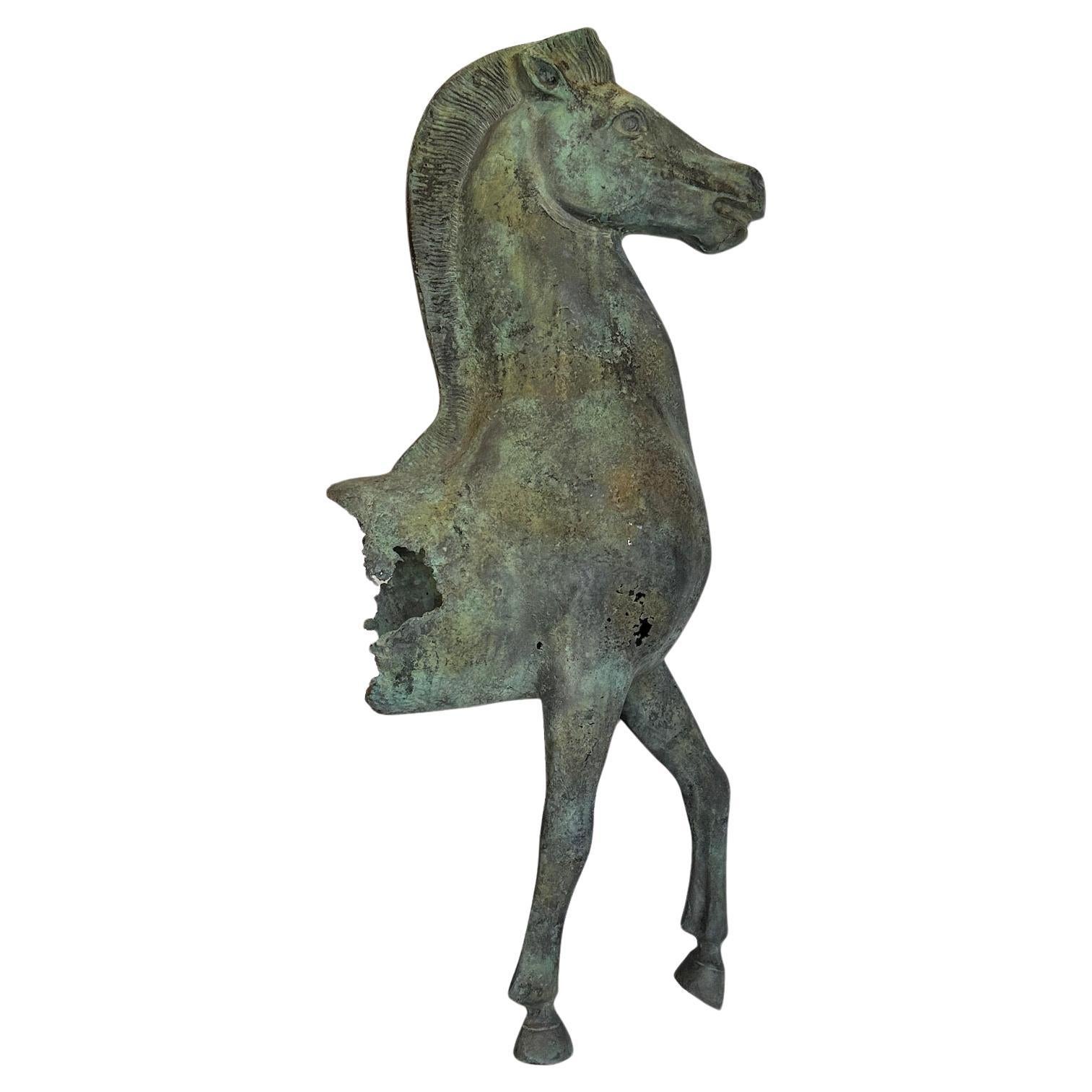 A verdigris bronze model fragment of a standing horse after the original statue at the Acropolis.  Mounted on a stepped marble plinth
