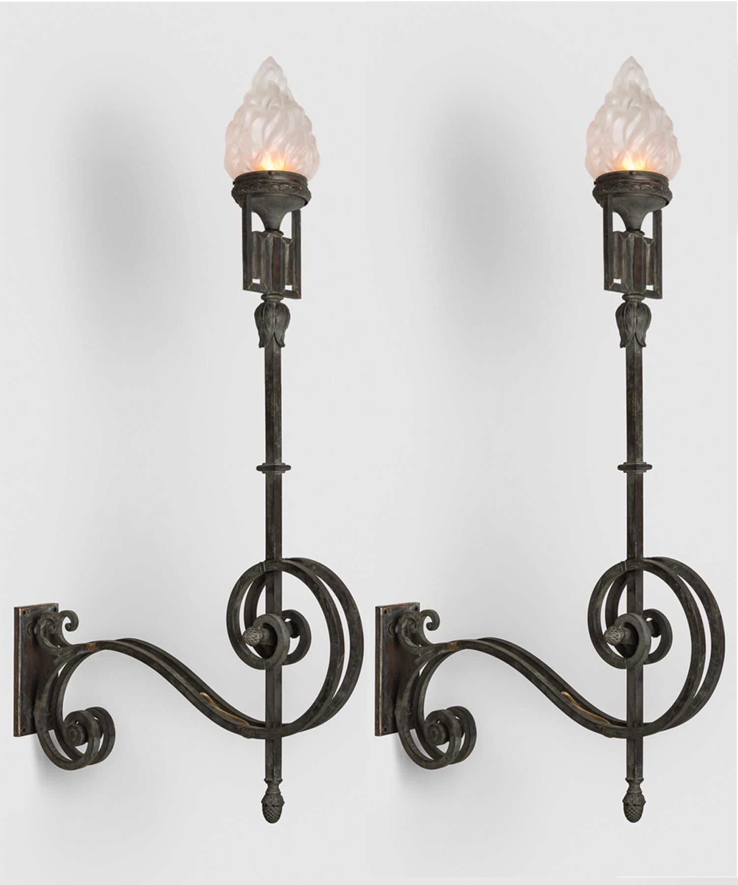 Verdigris bronze wall torch, circa 1880.

Large scale wall light with ornate arm and flame shade.