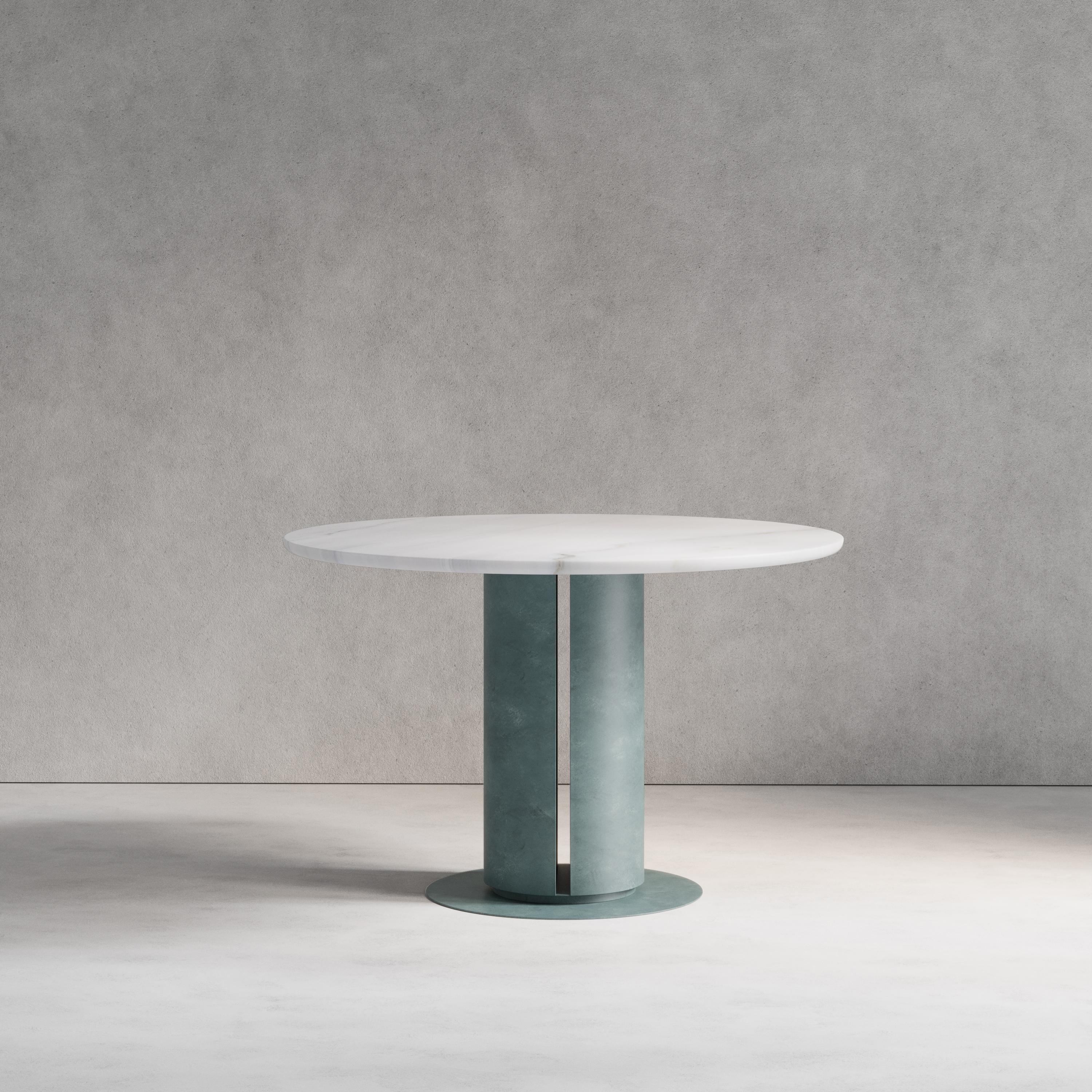 The Verdigris Dining Table combines both brass and marble, using patinated hand-spun brass and Bianco Lasa marble, this piece plays with both material properties and artisan finishes. Handmade in London.

Dimensions:
Dia. 120cm (47.24”) Height 76cm