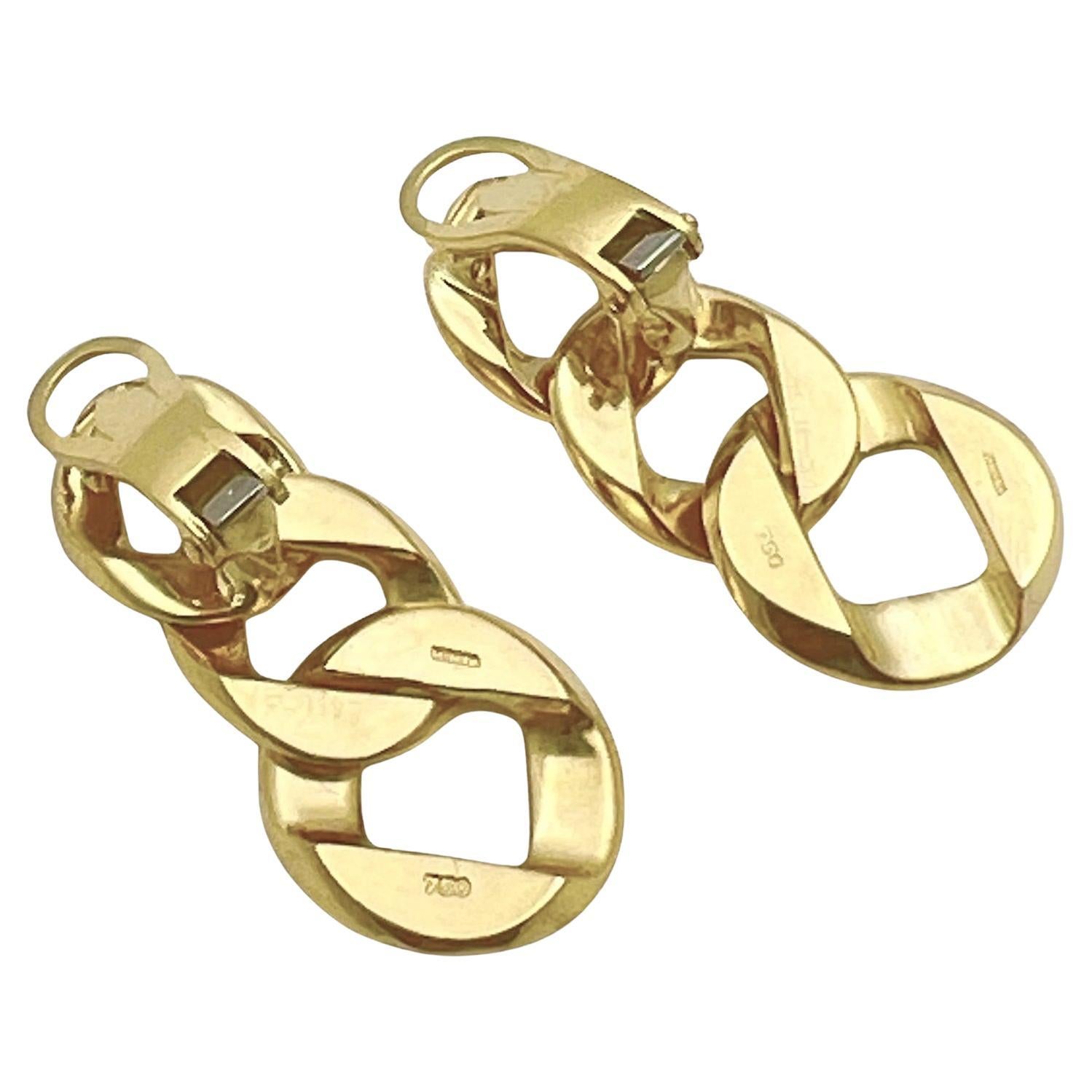 The Piccolo Curb-Link Earrings by Verdura.  Featuring three graduating interconnected curb-links in high-polished 18k yellow gold, measuring 1.11