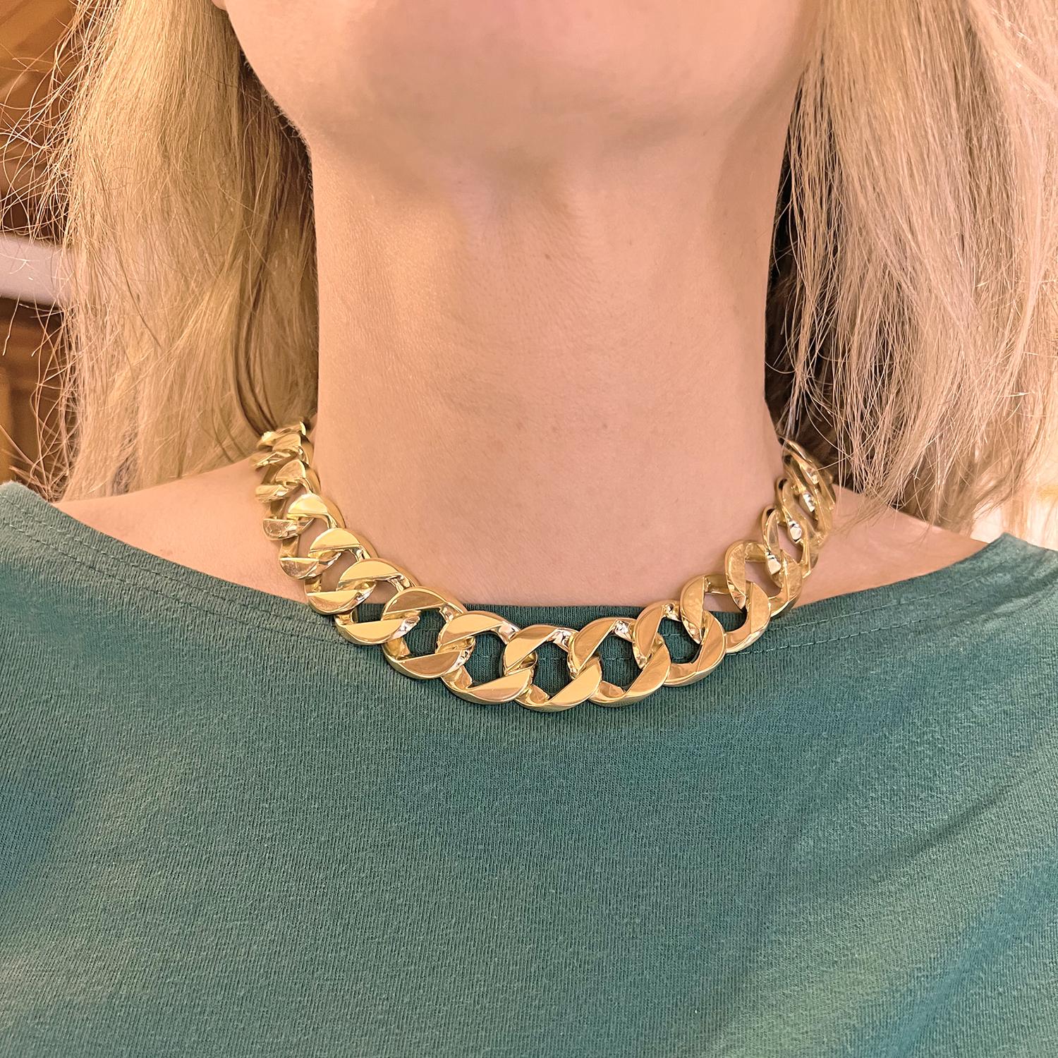 Indulge in the timeless allure of the authentic Verdura 18 karat yellow gold large curb link necklace. This magnificent piece exudes opulence and sophistication, captivating the eye with its exquisite design.

Measuring 17 inches in length and