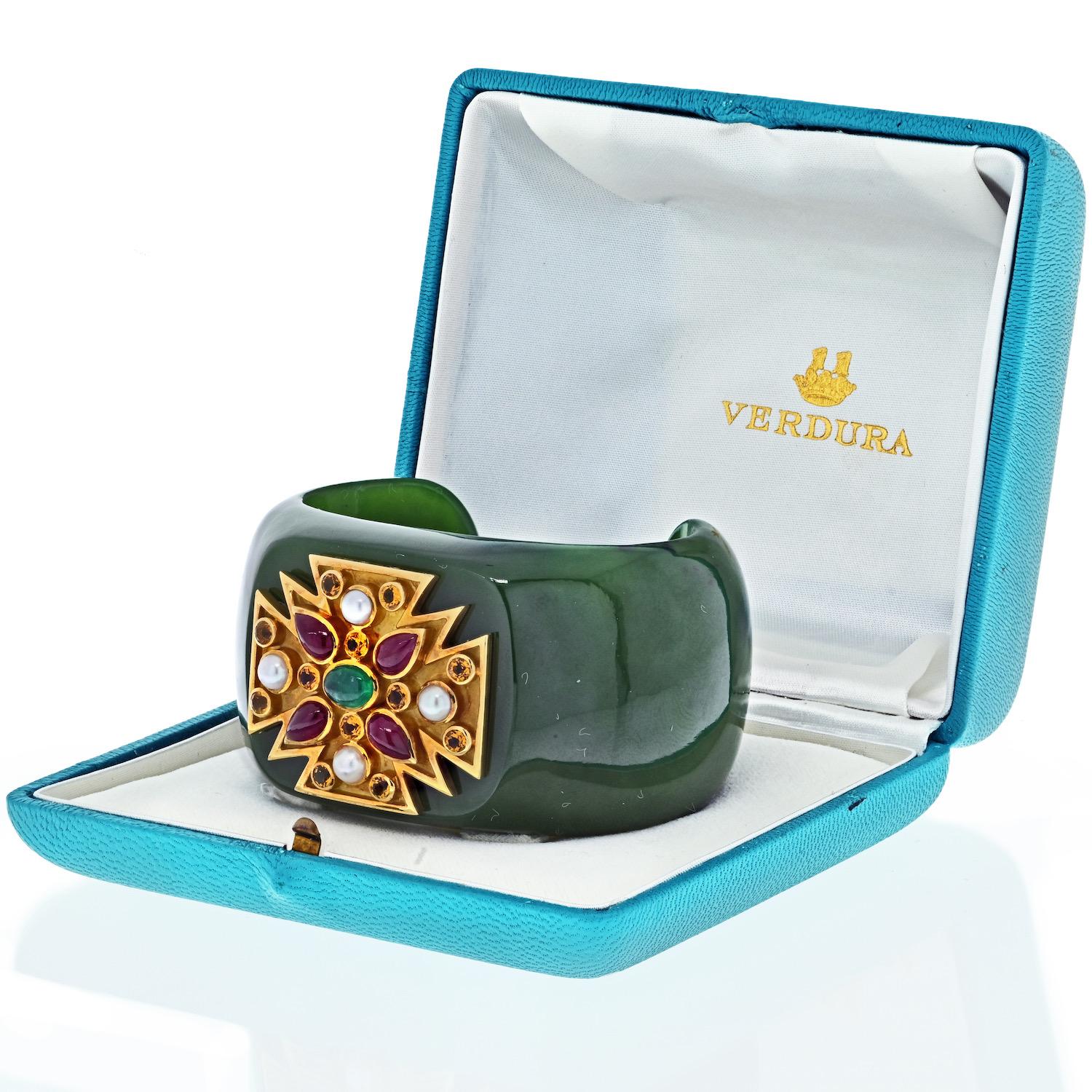 Featuring a Maltese cross with pearls, rubies, and emerald in the center fo the jadiate cuff this open bangle by Verdura is a stellar example of its type. This particular bangle is especially well made and is in exceptionally good condition. It is