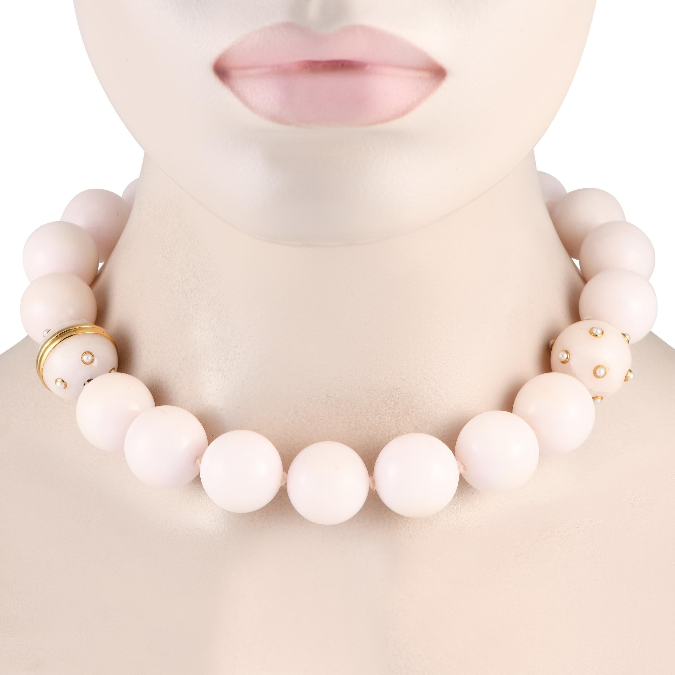 This statement-making Verdura necklace is bold and breathtaking in design. Crafted with a series of Rose Quartz orbs, 18K Yellow Gold accents and inset Pearls provide the perfect finishing touch. It measures 18 long.This jewelry piece is offered in