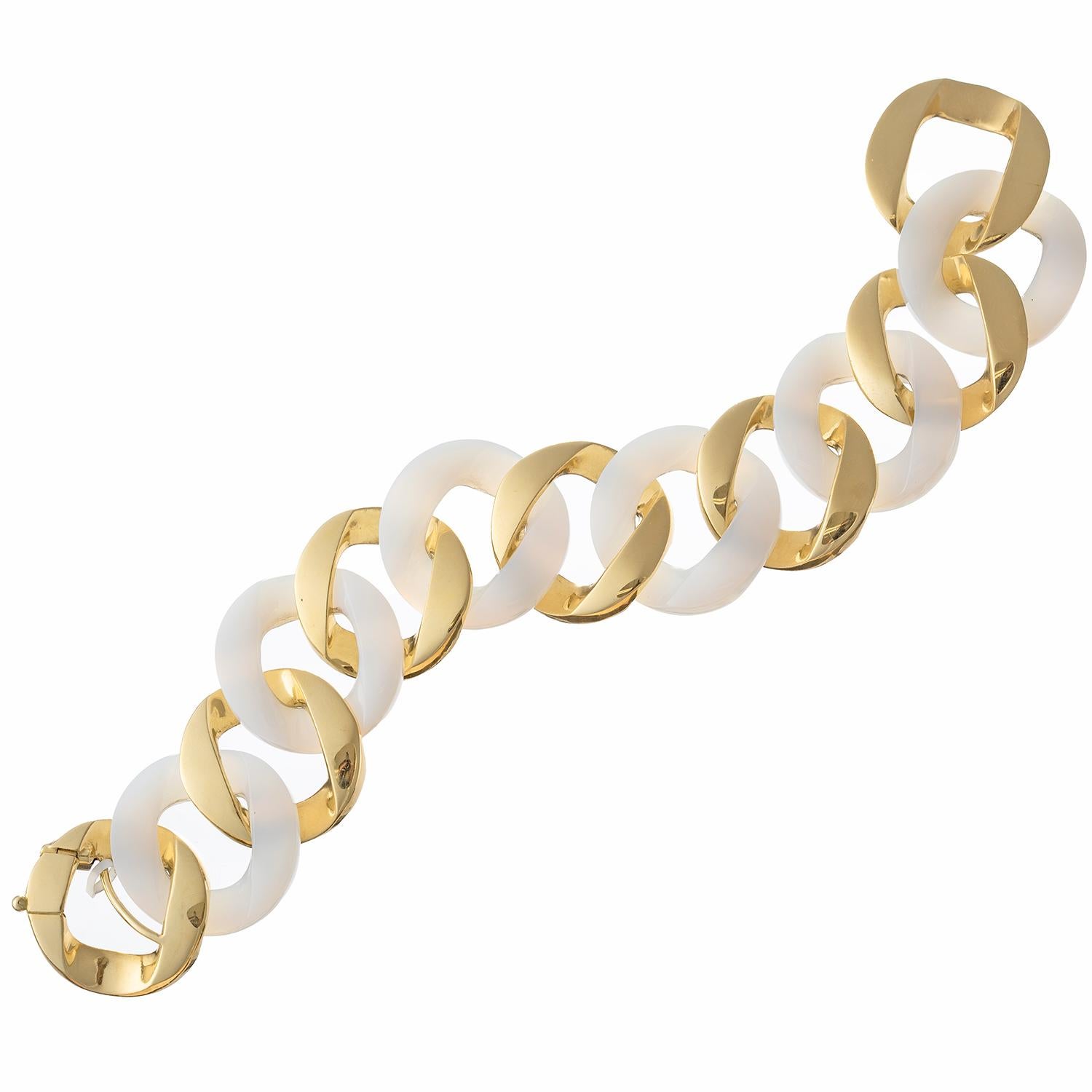 Curb-link bracelet, featuring alternating high-polished 18k yellow gold and carved white agate links. 8