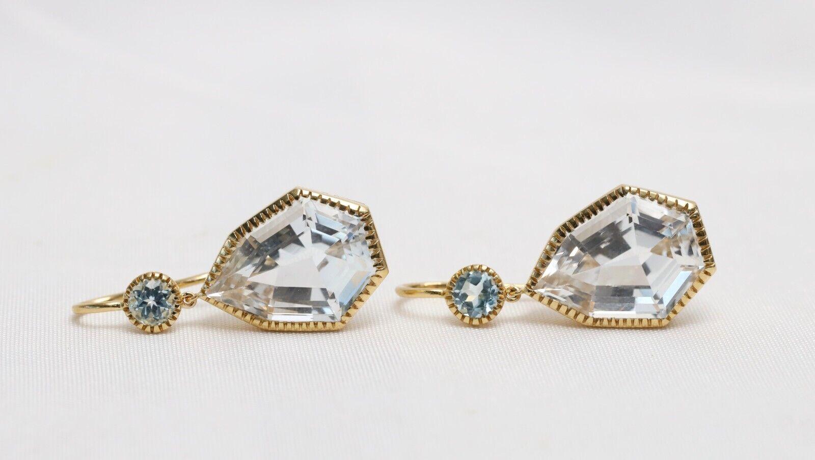 Known for their timeless, elegant original designs, Verdura fine jewelry is perfect for any jewelry collector. This stunning pair of earrings is crafted from a high quality 18k yellow gold. These earrings feature two beautiful fancy cut white topaz