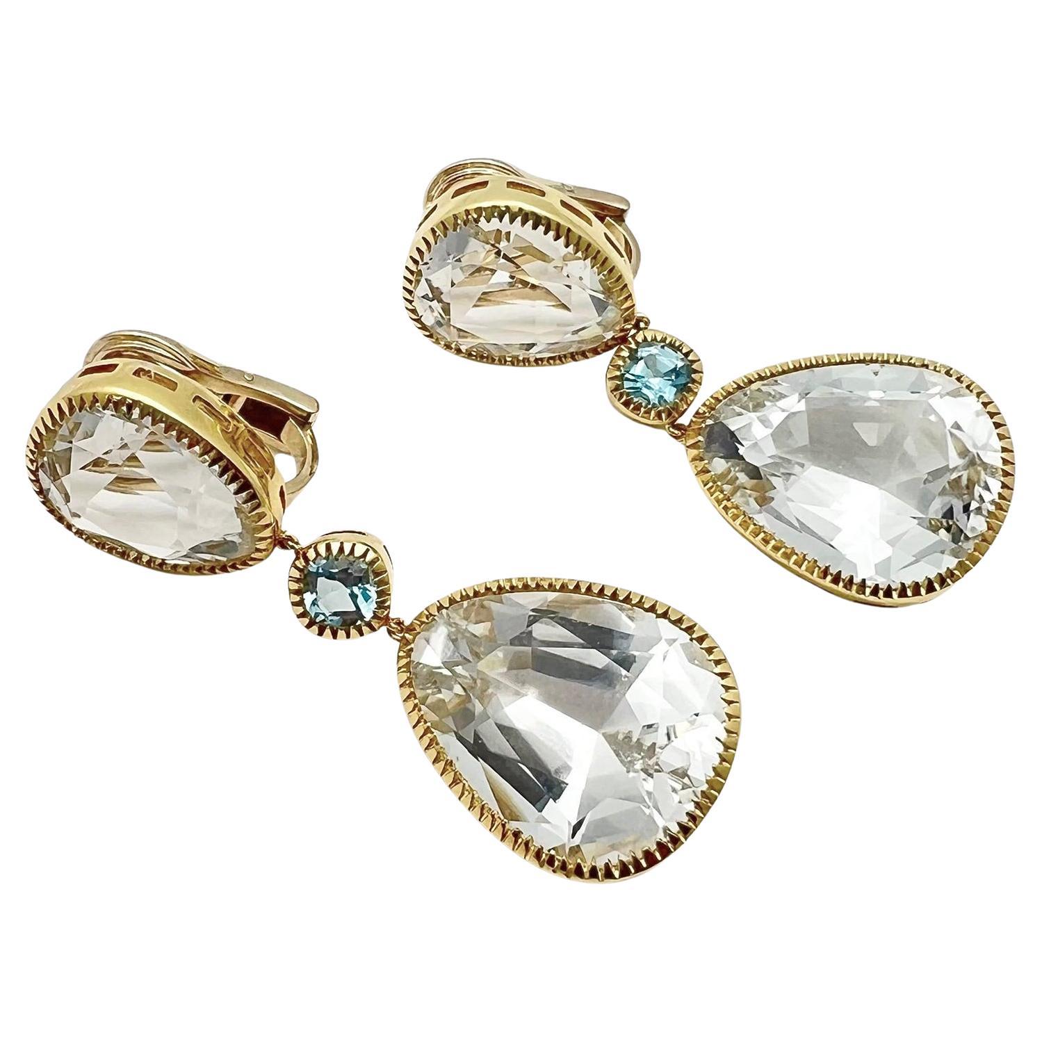 Verdura Byzantine drop earrings in 18k yellow gold, featuring pear-shaped white topaz at top and bottom, enhanced by square cushion-shaped blue topaz at center.  Four white topaz weighing approximately 58.00 total carats and two blue topaz weighing