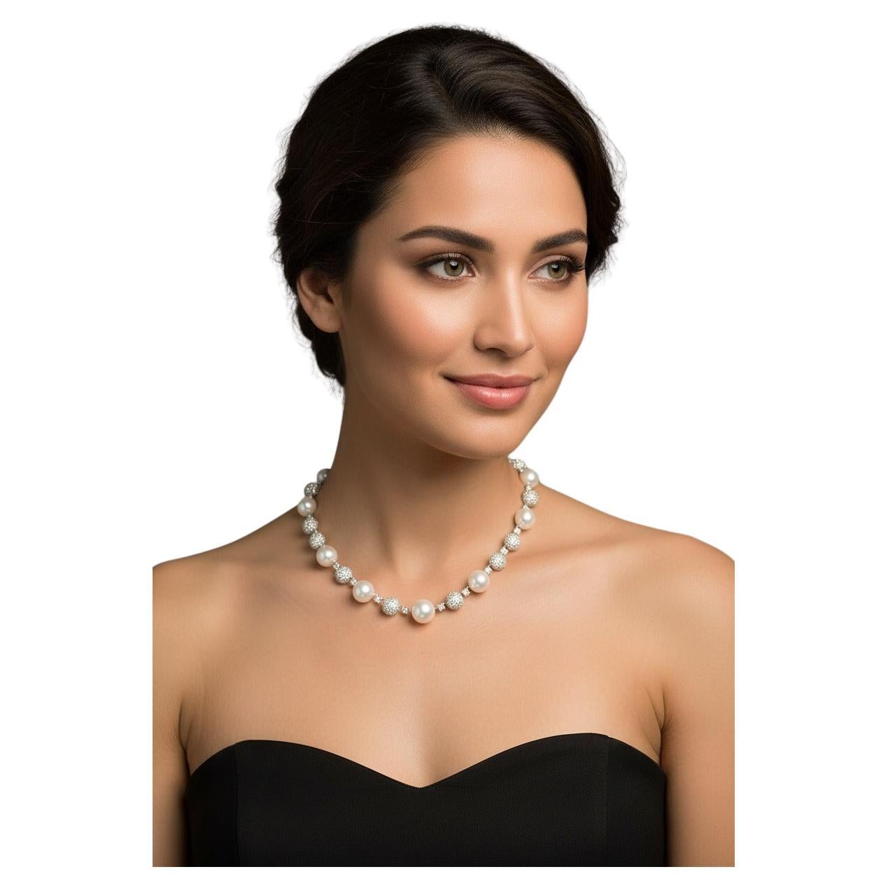 Verdura South Sea Pearl and Diamond Necklace

An extraordinary Verdura creation featuring luminous South Sea pearls measuring 13.5–14.5 mm. The necklace is further enhanced by approximately 25 carats of natural diamonds, F color and VVS clarity,