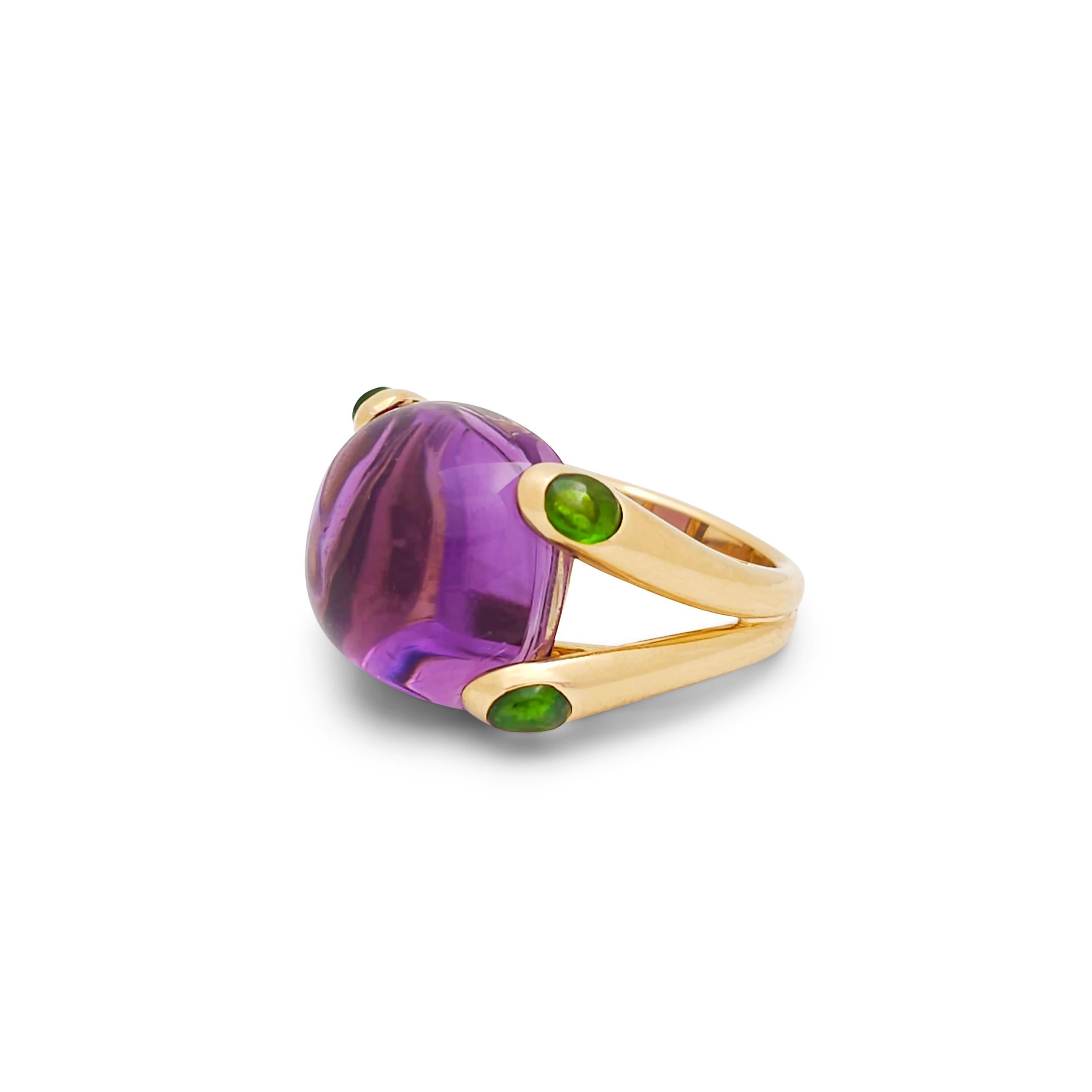 Authentic Verdura 'Candy' ring is one of Fulco di Verdura's earliest and most iconic designs. Crafted in 18 karat yellow gold, the ring centers on a lilac-hued cushion-shaped cabochon amethyst stone that is cornered by four contrasting tourmaline