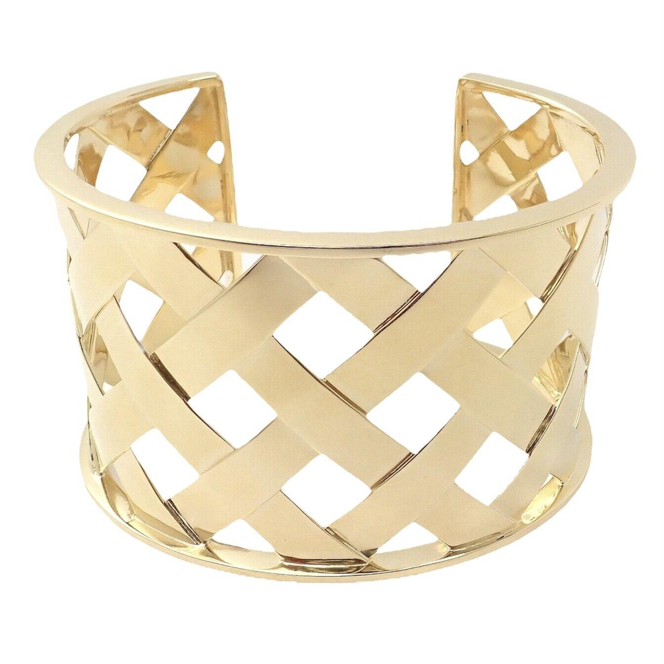 18k Yellow Gold Criss Cross Wide Cuff Bangle Bracelet by Verdura. 
Details: 
Weight: 66.3 grams
Width: 1.5