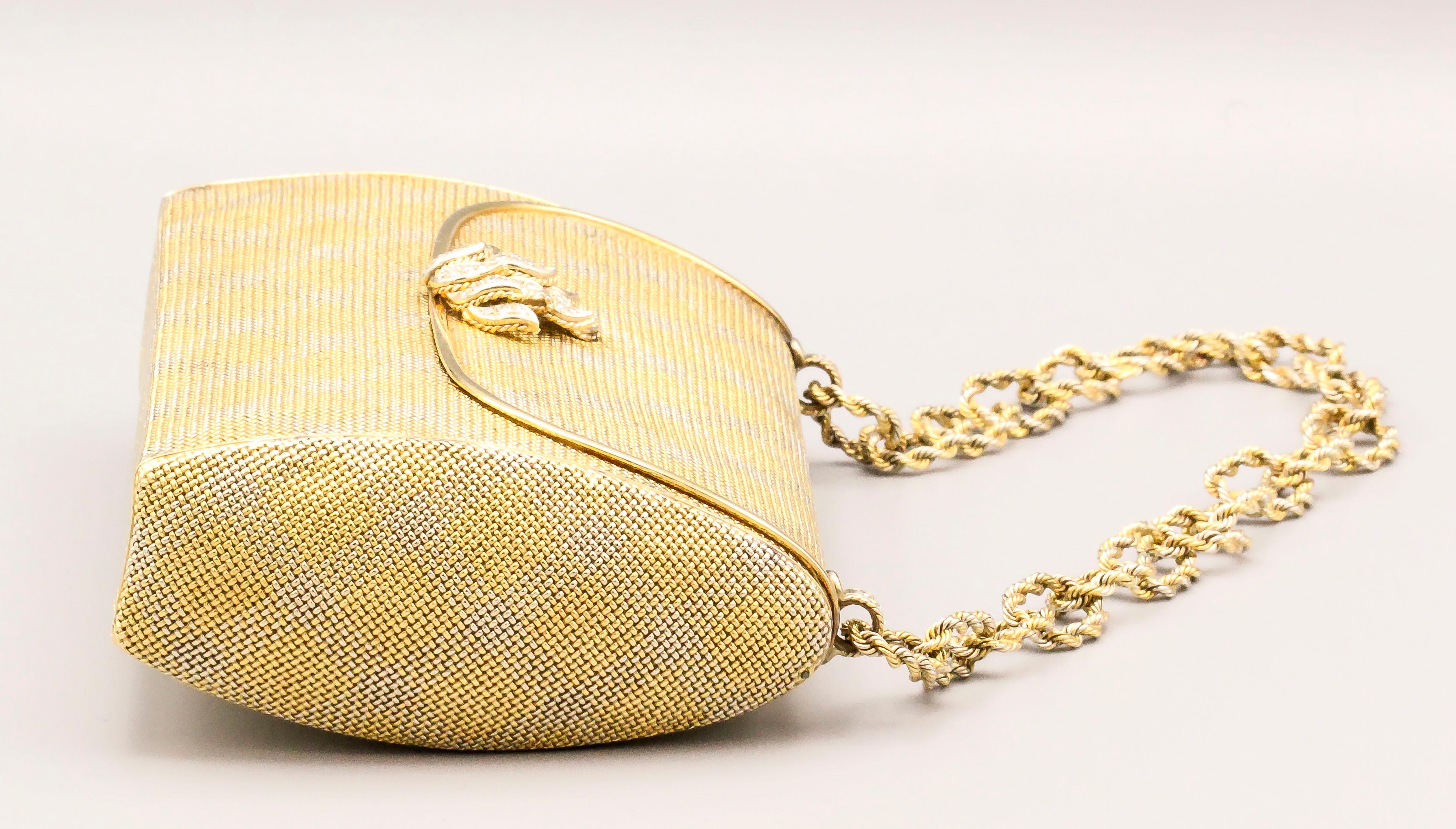 Fine diamond and 18K yellow gold evening purse by Verdura, circa 1980s. It features a two color gold mesh design, with diamond and gold thumb leaves-like piece, and rope link chain.  The diamond are high grade white diamonds, approx. 2 carats total