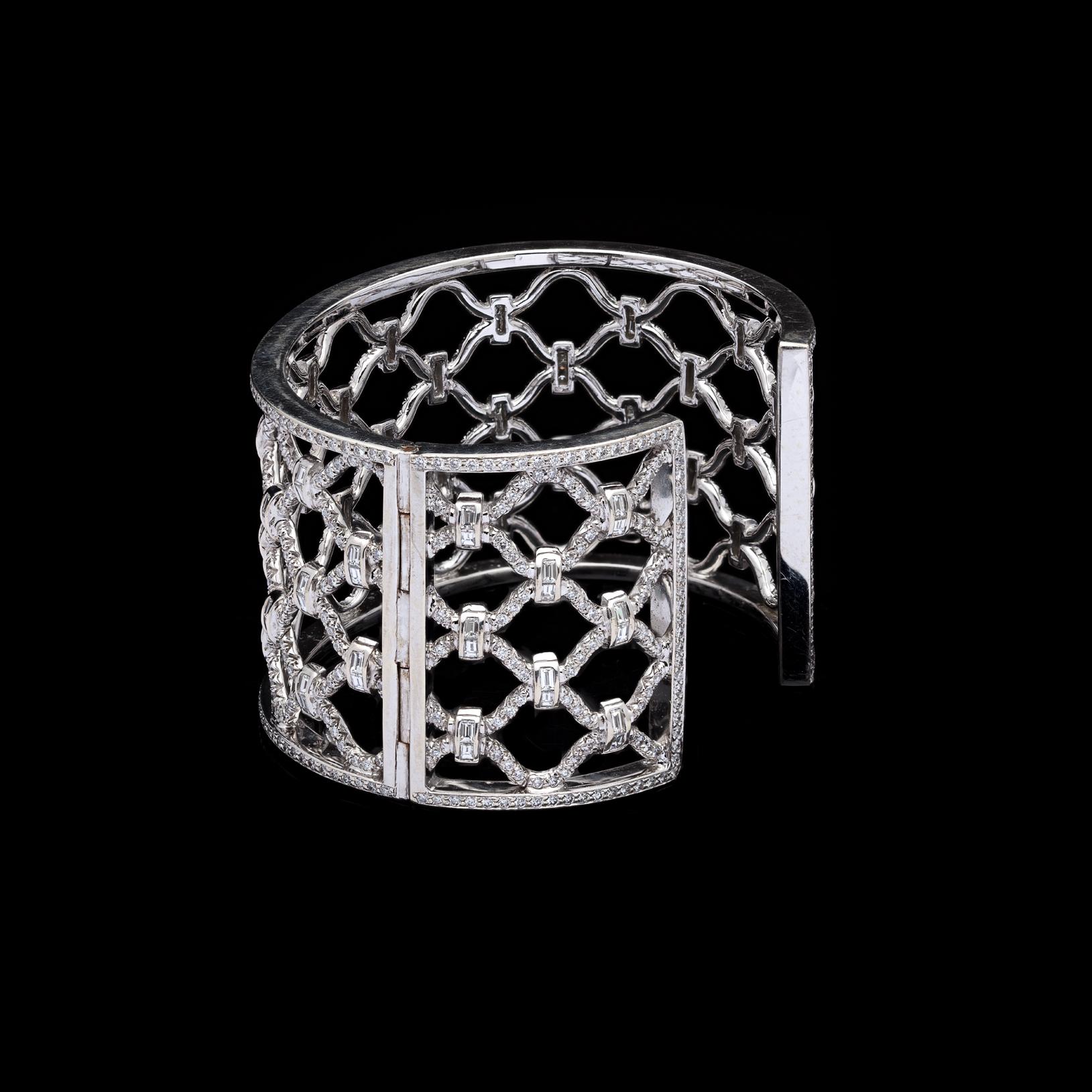 Inspired by the intricate grillwork of London gates, Verdura adapted this familiar pattern into his creations in the 1940s. The 18k white gold Kensington bracelet is set with 740 pavé round brilliant and baguette-cut diamonds, with a total weight
