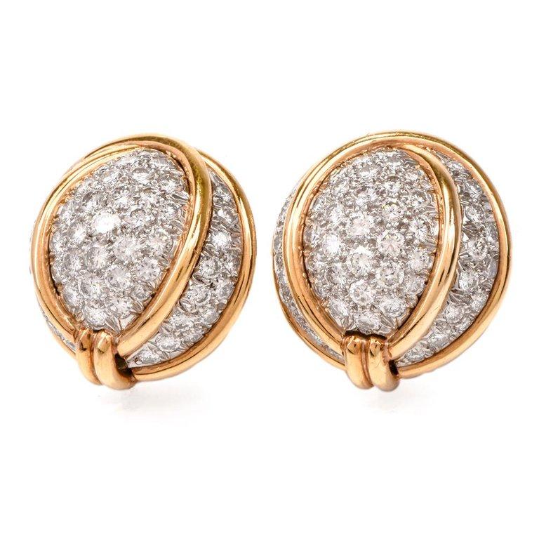 These very Chic Verdura earrings are rendered in Platinum and 18 Karat yellow gold, weigh 33.5 grams and measure 21 mm in diameter. Incorporating a pair of gracefully domed plaques, the earrings are adorned collectively with 4.50 carats of pave-set