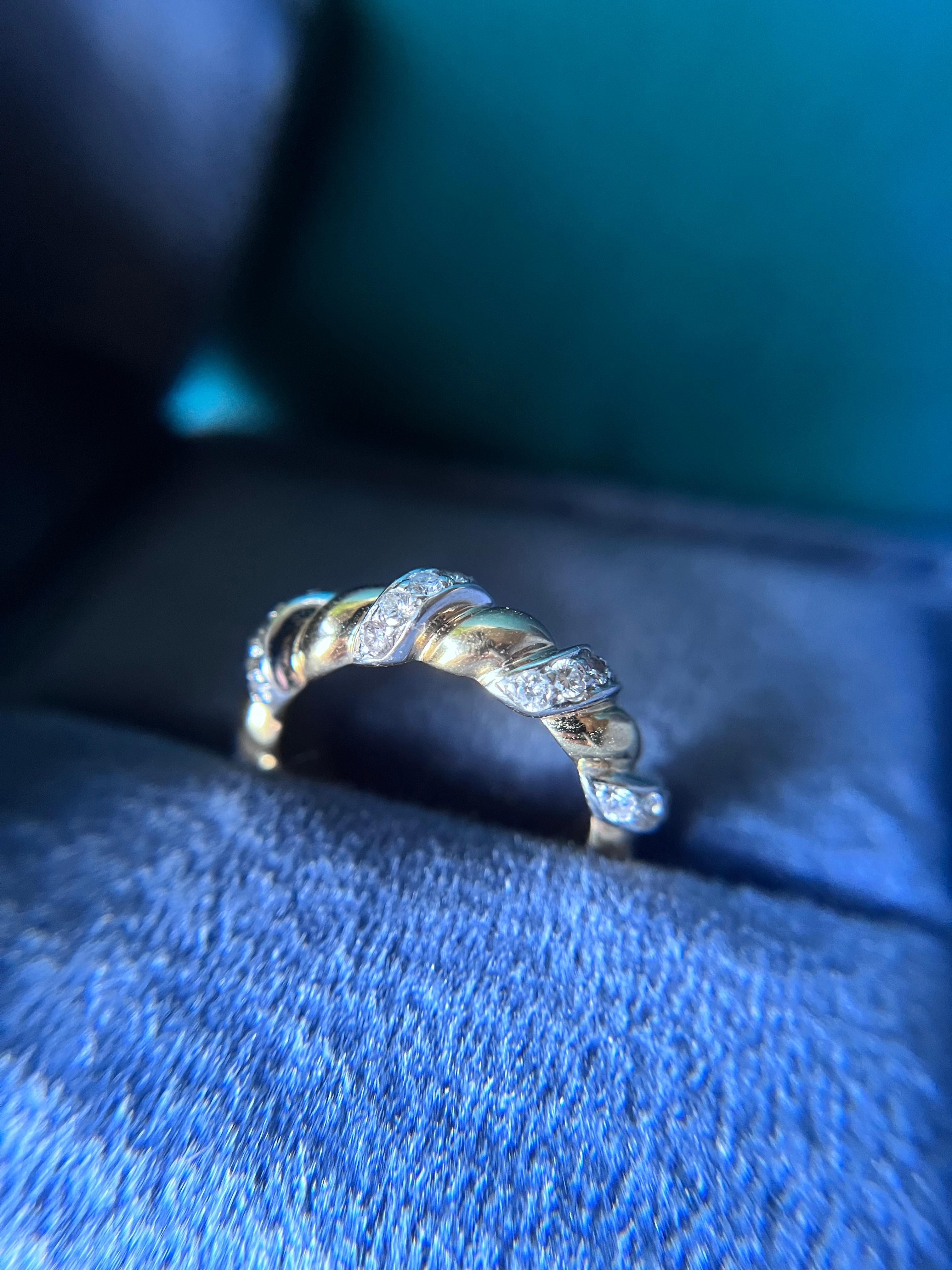 This timeless ring by Verdura is crafted of 18k yellow gold and platinum in a lovely twisted design. The platinum is inlaid with a sprinkling of white diamonds, adding just the right amount of sparkle.

It's perfect for stacking with other rings or