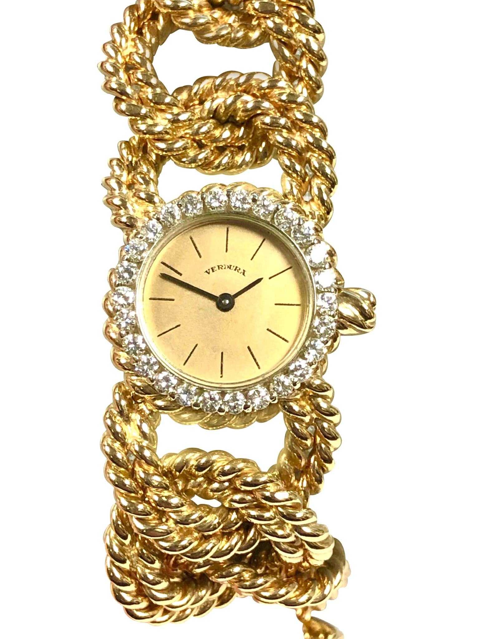 Circa 1970s Verdura Ladies Bracelet Wrist Watch, 25 M.M. Diameter 14K yellow Gold 2 Piece case, Round Brilliant cut Diamond bezel totaling 1 Carat. 17 Jewel Cresaux Switzerland Mechanical, manual wind movement. 7/8 inch wide Double row twisted Rope