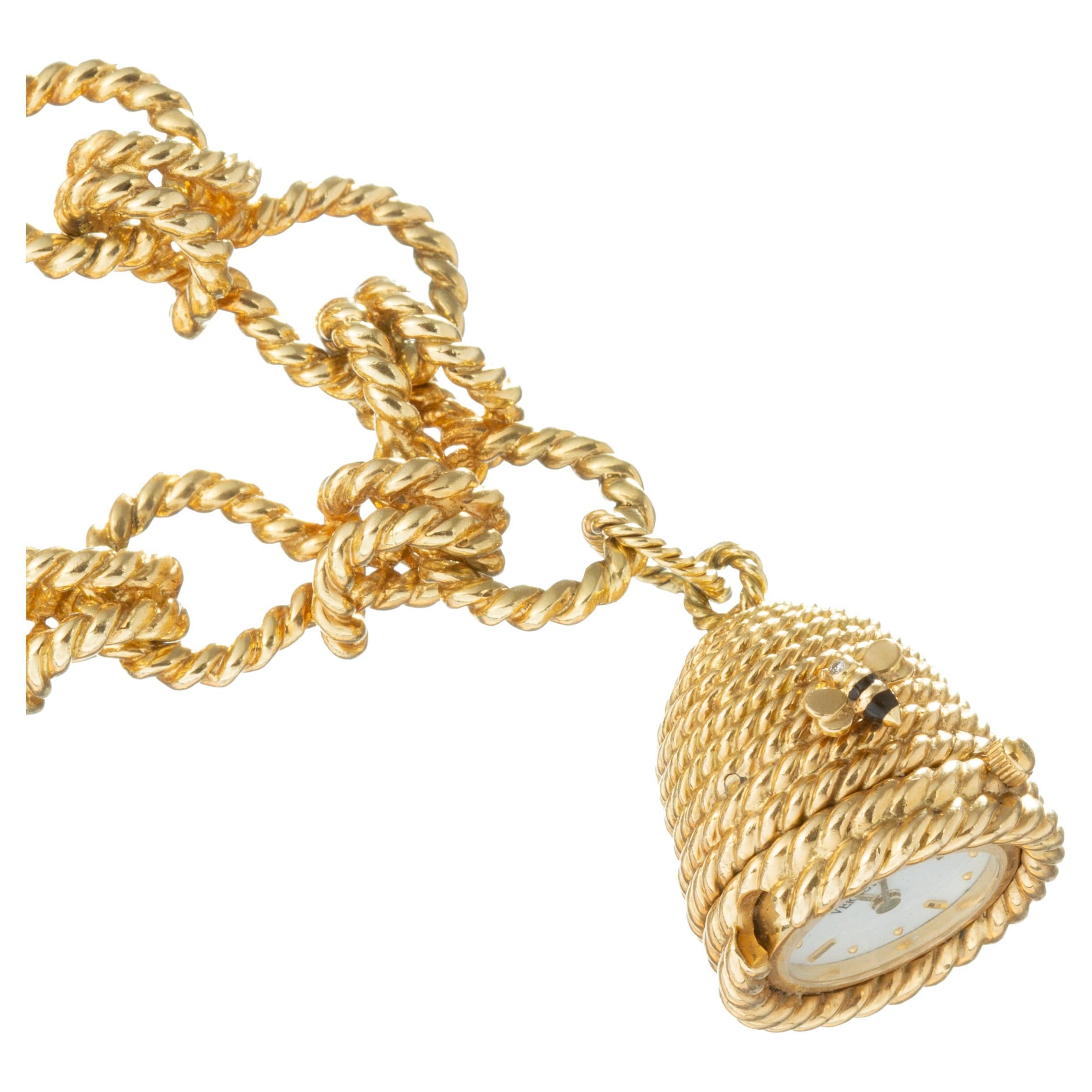 Verdura 18kt yellow gold rope-twist link bracelet with beehive motif watch charm pendant in 18k yellow gold.  The watch pendant measures 25 x 20mm.  White lacquered watch dial with 