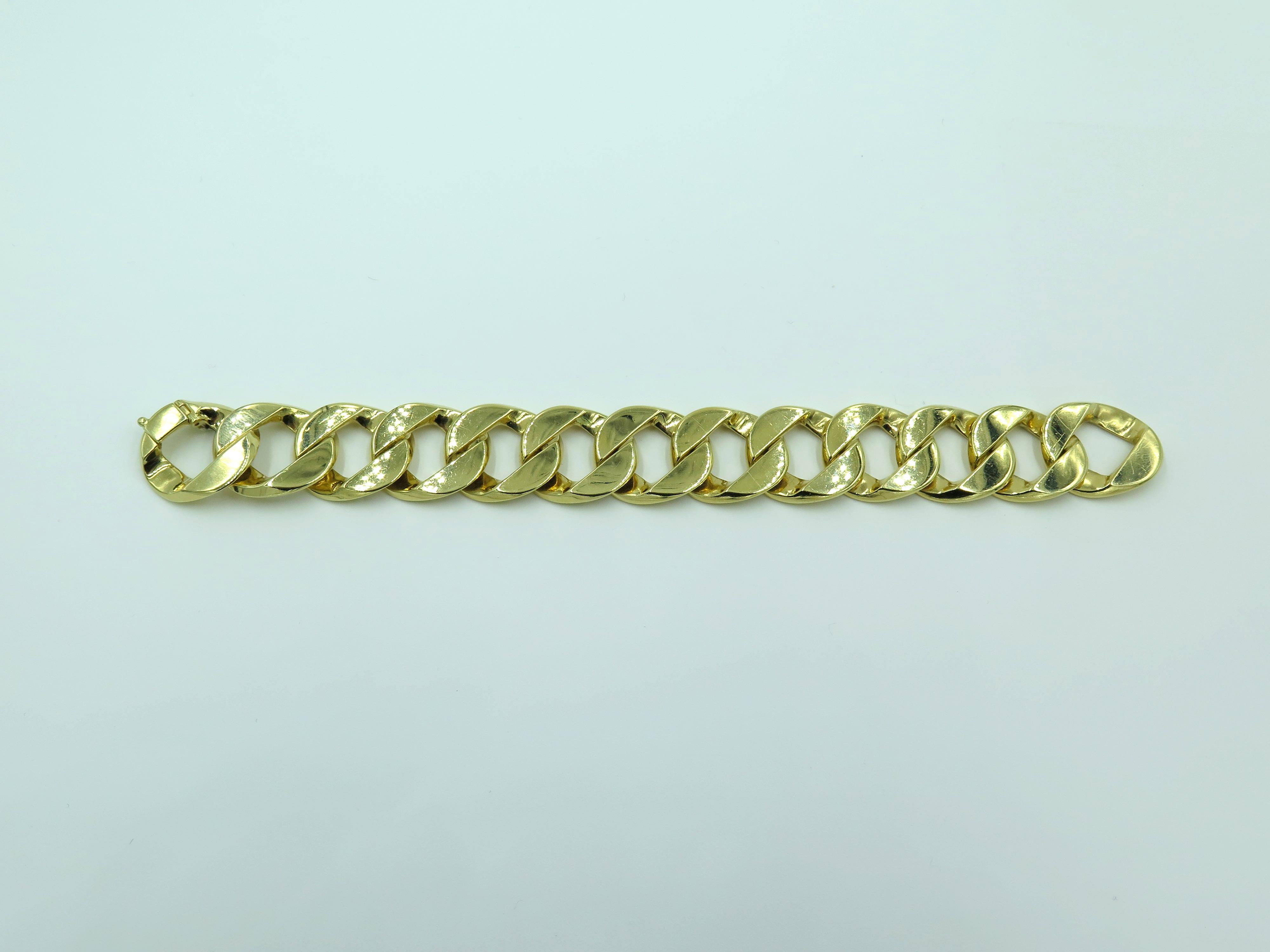 An 18 karat yellow gold Curb Link Bracelet. Verdura. Designed as a series of sculpted gold interlocking links. Length is approximately 7 1/4 inches, gross weight is approximately 97.6 grams. Stamped Verdura 750.