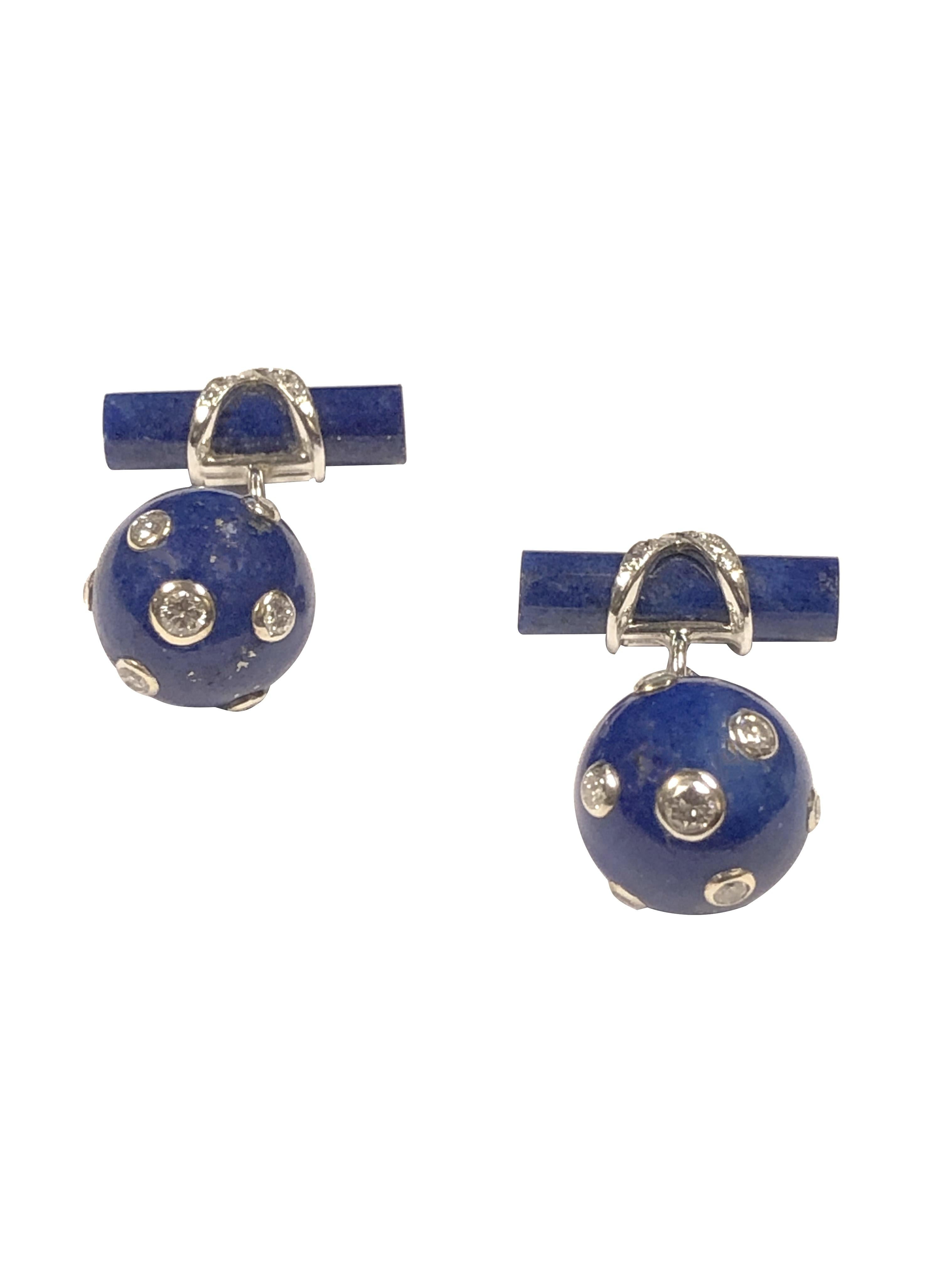 Circa 2000 Verdura Cufflinks, Comprised of a Lapis Lazuli Ball measuring 1/2 inch and diameter, 7 Gold bezel set Round Brilliant cut Diamonds, a white gold chain connects a Lapis Bar that has a Diamond set X decoration. Diamond total weight for the