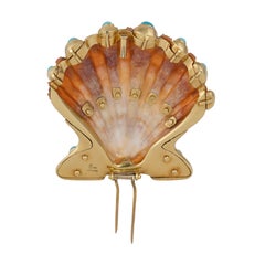 Spilla in oro, diamanti, turchesi e zampe di leone di Verdura