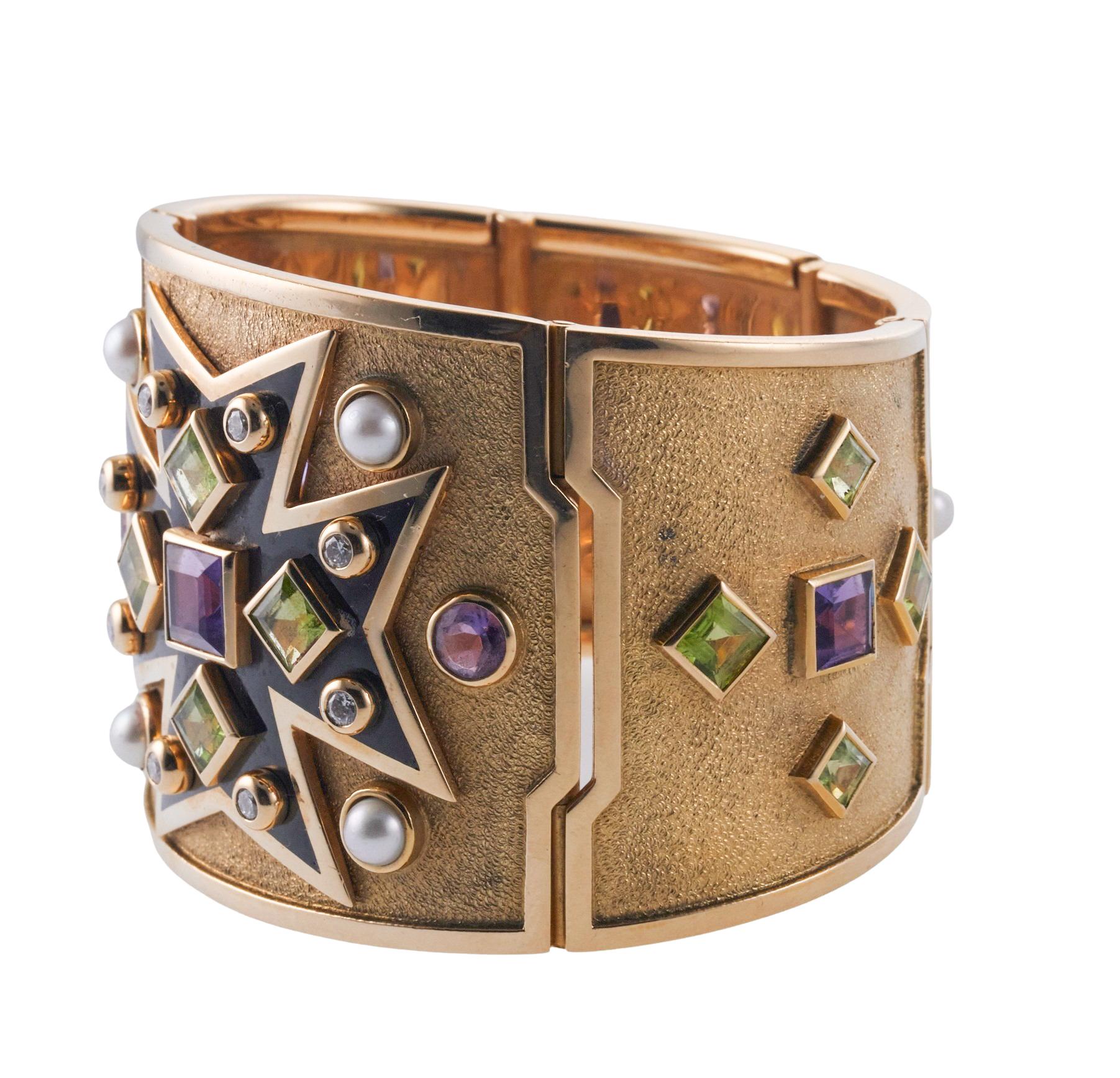 Iconic Maltese Cross wide cuff bracelet by Verdura in 18k gold , set with peridots, pearls, amethyst and approx. 0.40ctw in VS/G diamonds. Bracelet will fit 6