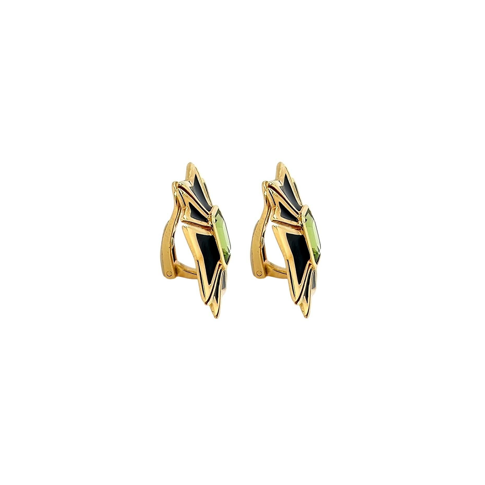 A pair of 18 karat yellow gold, peridot and enamel earclips, Verdura.  Each Maltese Cross earclip designed as a Maltese cross of black enamel centering a bezel set emerald cut peridot.  Length approximately 7/8 inches.  Gross weight approximately
