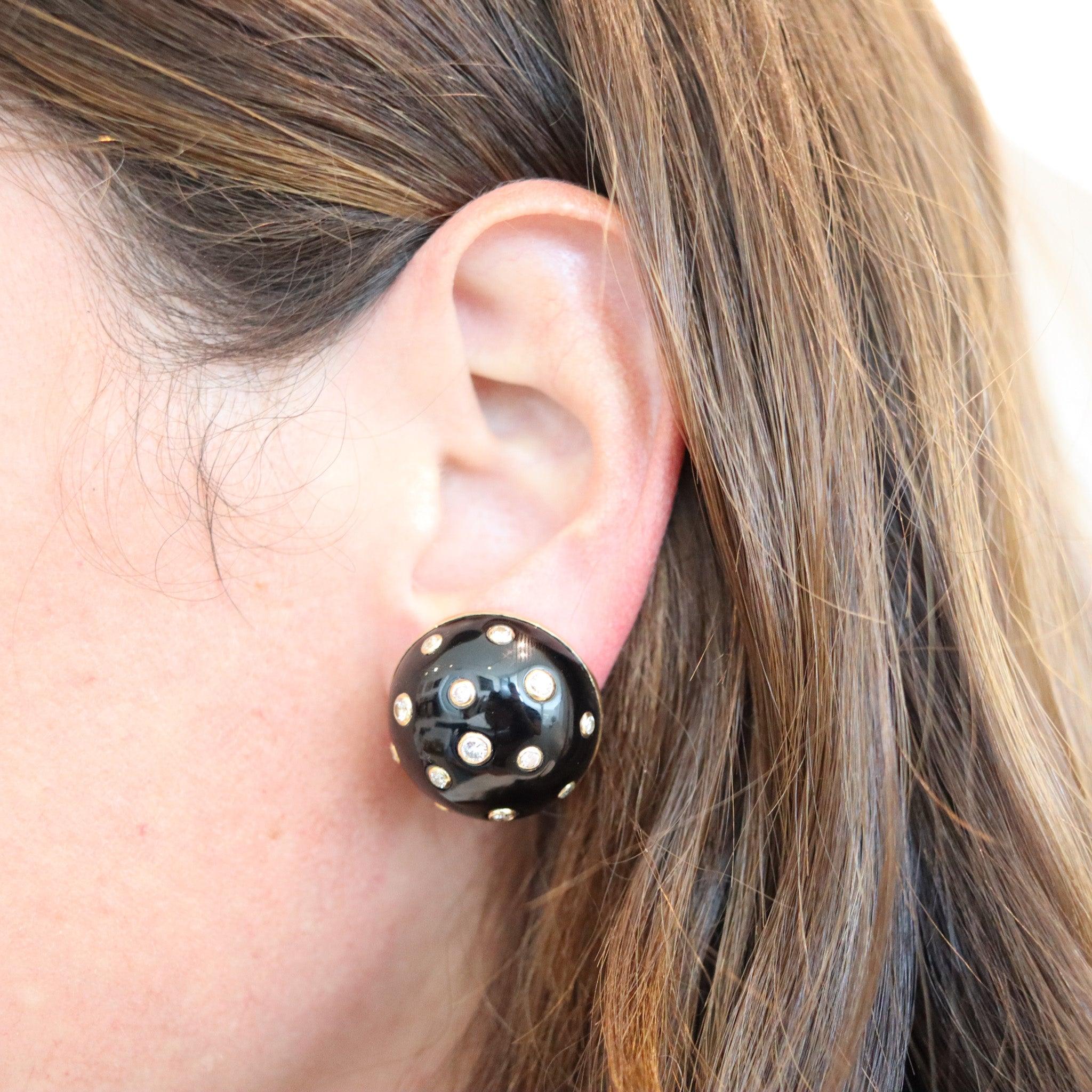 Pair of enameled clips-on earrings designed by Verdura.

This is a very rare pair of clips-on earrings, created in Milano Italy by the renowned jewelry house of Verdura. These round domed clips have been carefully crafted in solid yellow gold of 18