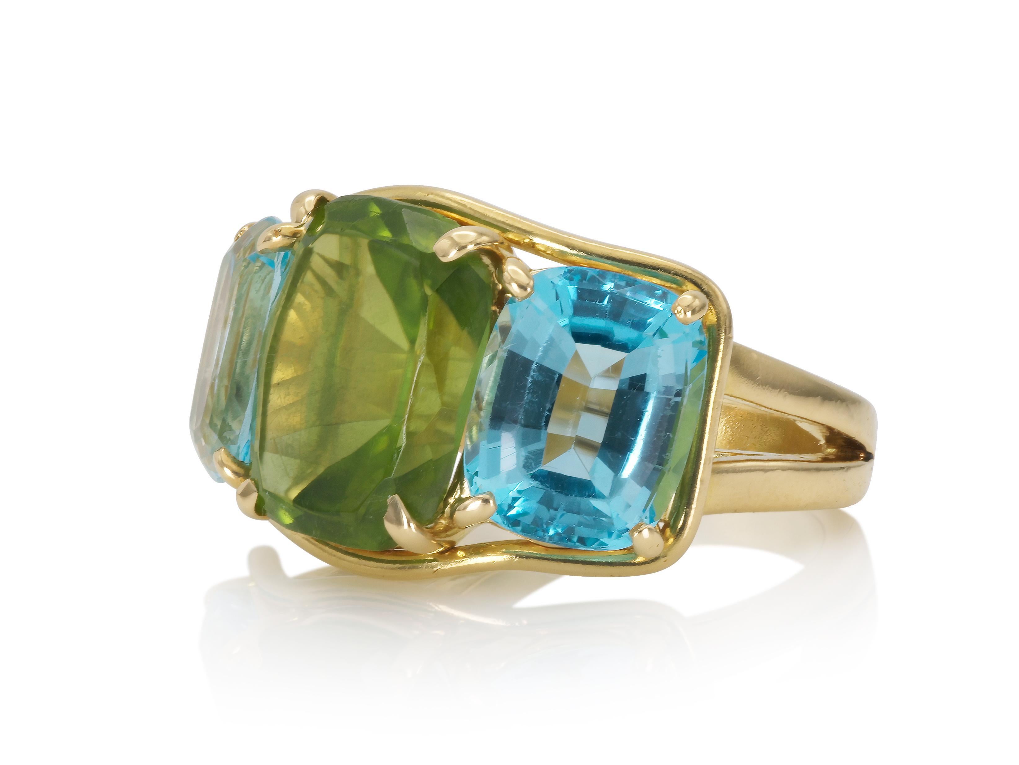 Finely crafted in 18k yellow gold with a center Peridot weighing approximately 6.80 carats, and two Blue Topaz weighing approximately a total of 6.90 carats.
Signed by Verdura
Size 5 3/4, resizable