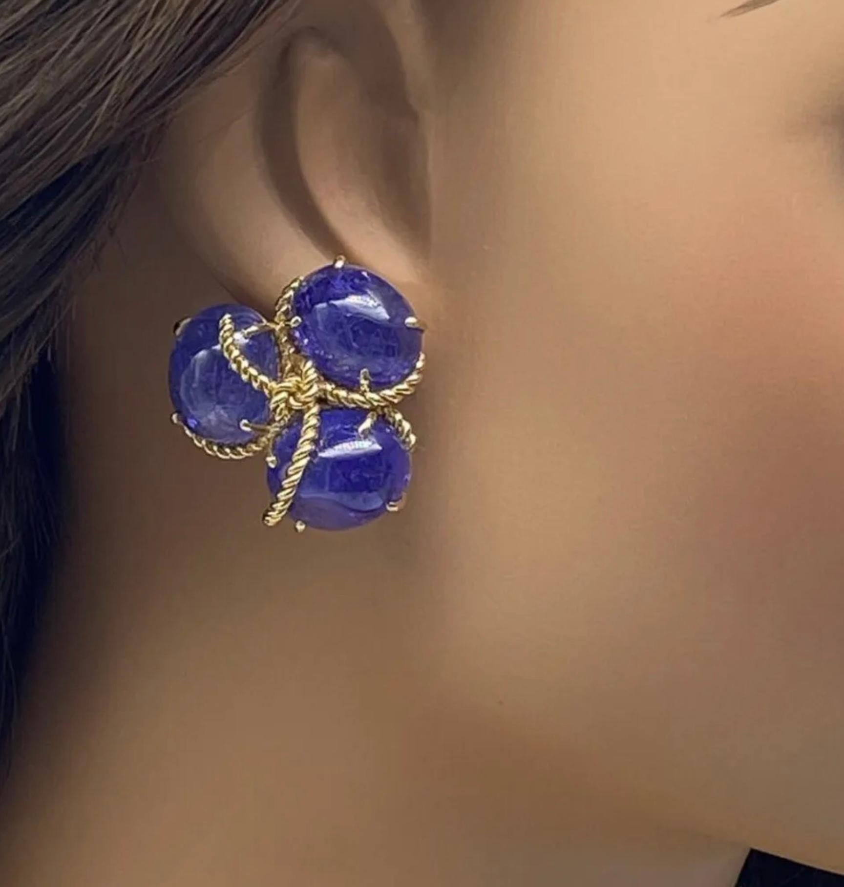 Verdura Polished Stone Tanzanite & 18k Rope Gold Clip On Earrings.

Verdura Tanzanite & 18k Gold Earrings Clip On Style - 1 1/4”. Polished stones in rope like gold pattern - described by Verdura as “beautiful polished pebbles, fished from the bottom