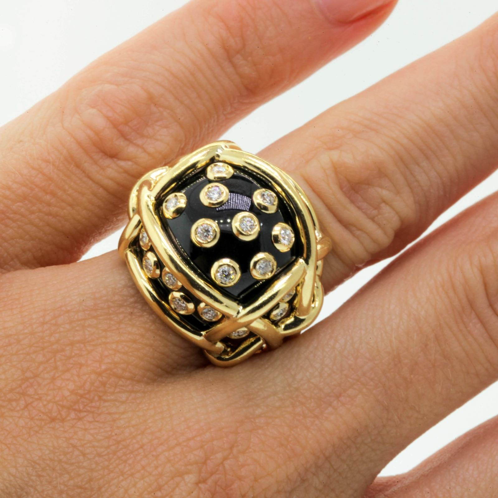 One of Fulco  di Verdura's classic and earliest designs, this fun and very wearable beauty, the Polka Dot ring is fabricated in 18KT yellow gold of Black Jade encrusted with twenty seven Round Brilliant Cut Diamonds set in gold colletes.  The ring
